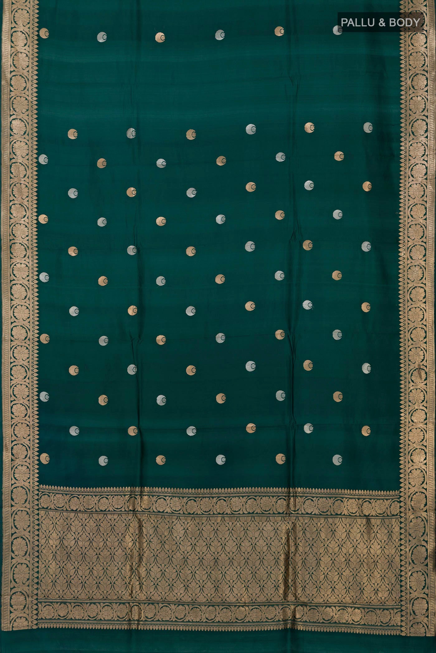 Flat view of Bottle Green Banarasi Katan Silk Saree with Zari Butta on the body and Zari Border. 