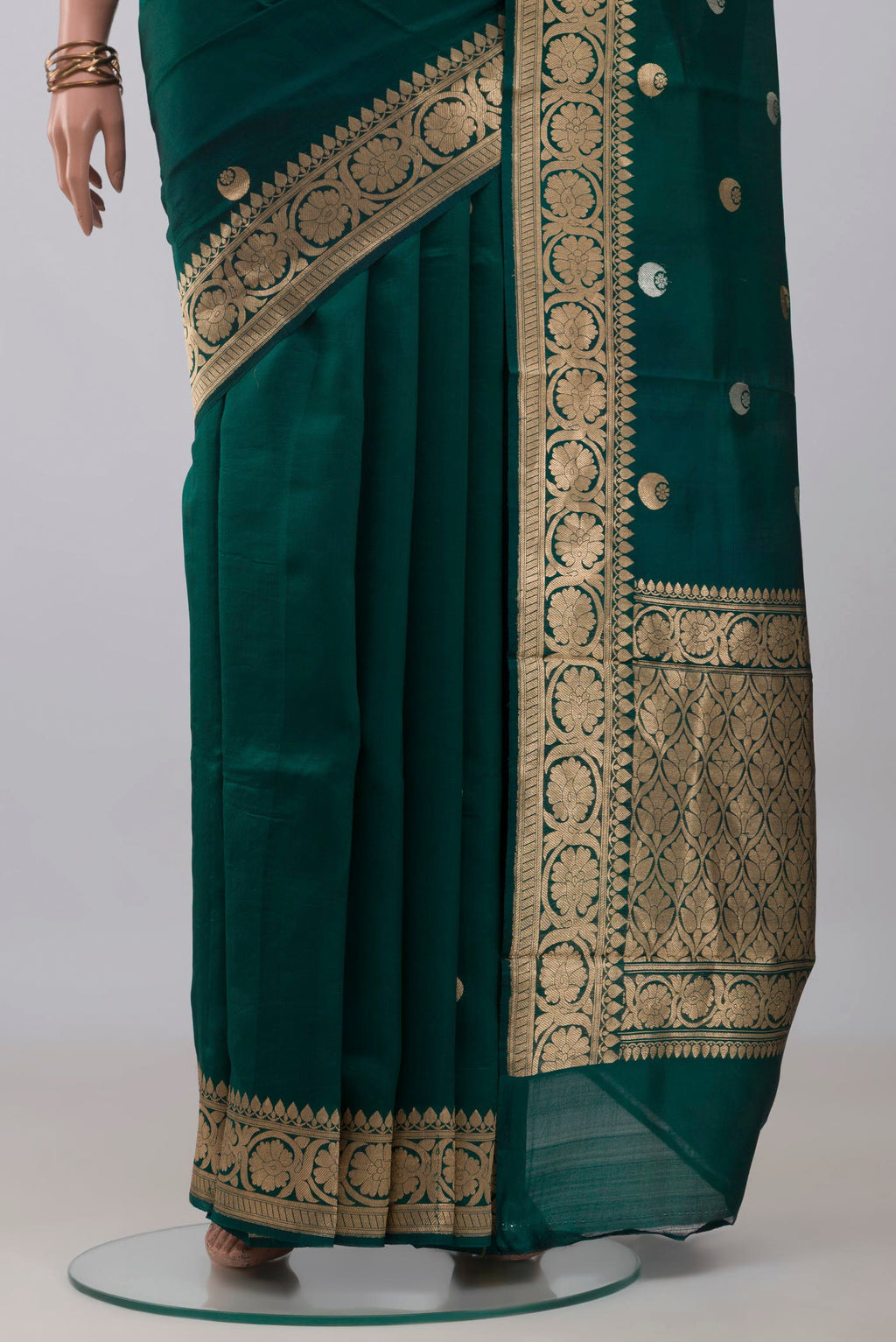 Pleats and pallu of Bottle Green Banarasi Katan Silk Saree with Zari Butta on the body and Zari Border. 