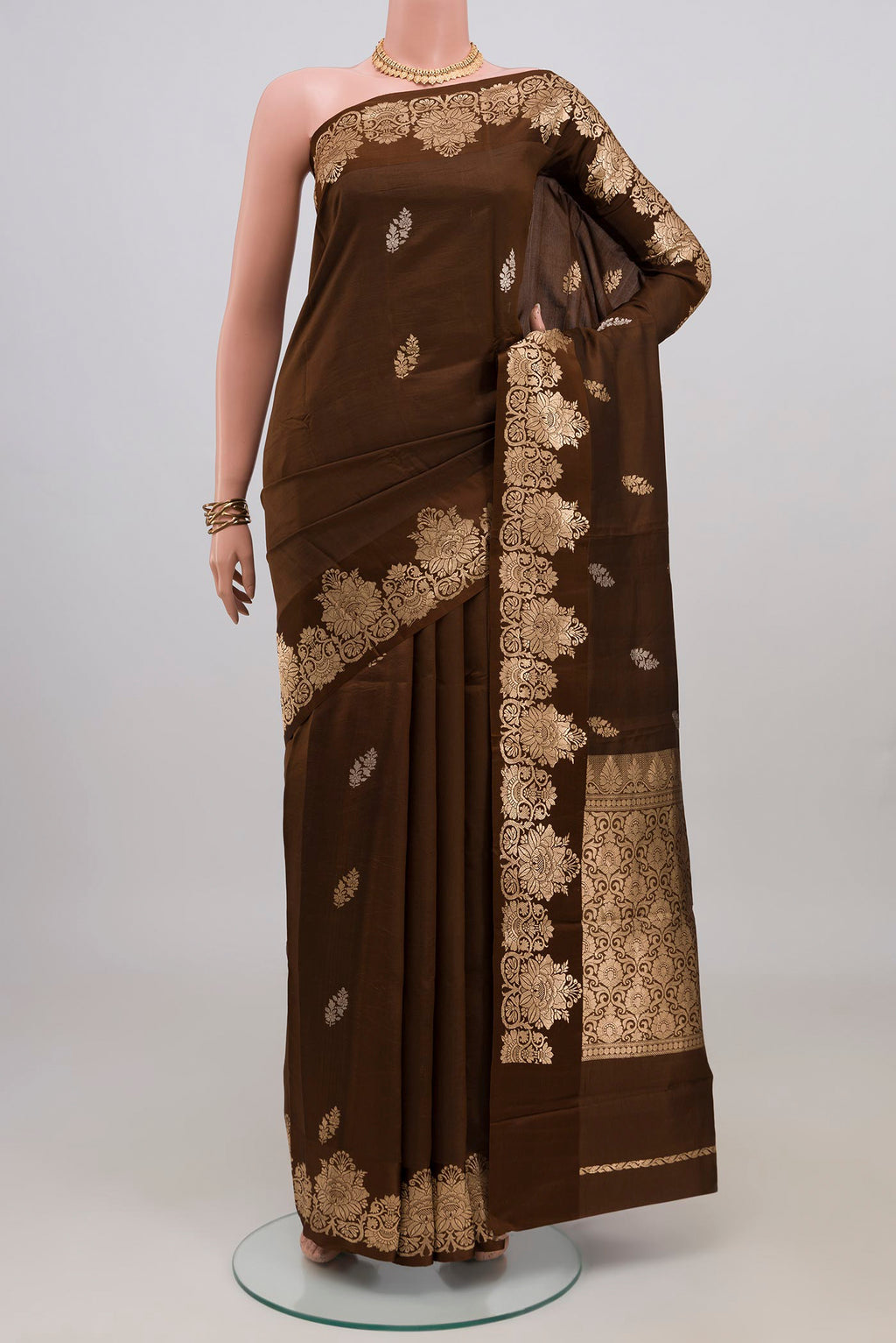 Brown Banarasi Katan Silk Saree with Zari Butta on the body and Zari Border.  displayed on a mannequin