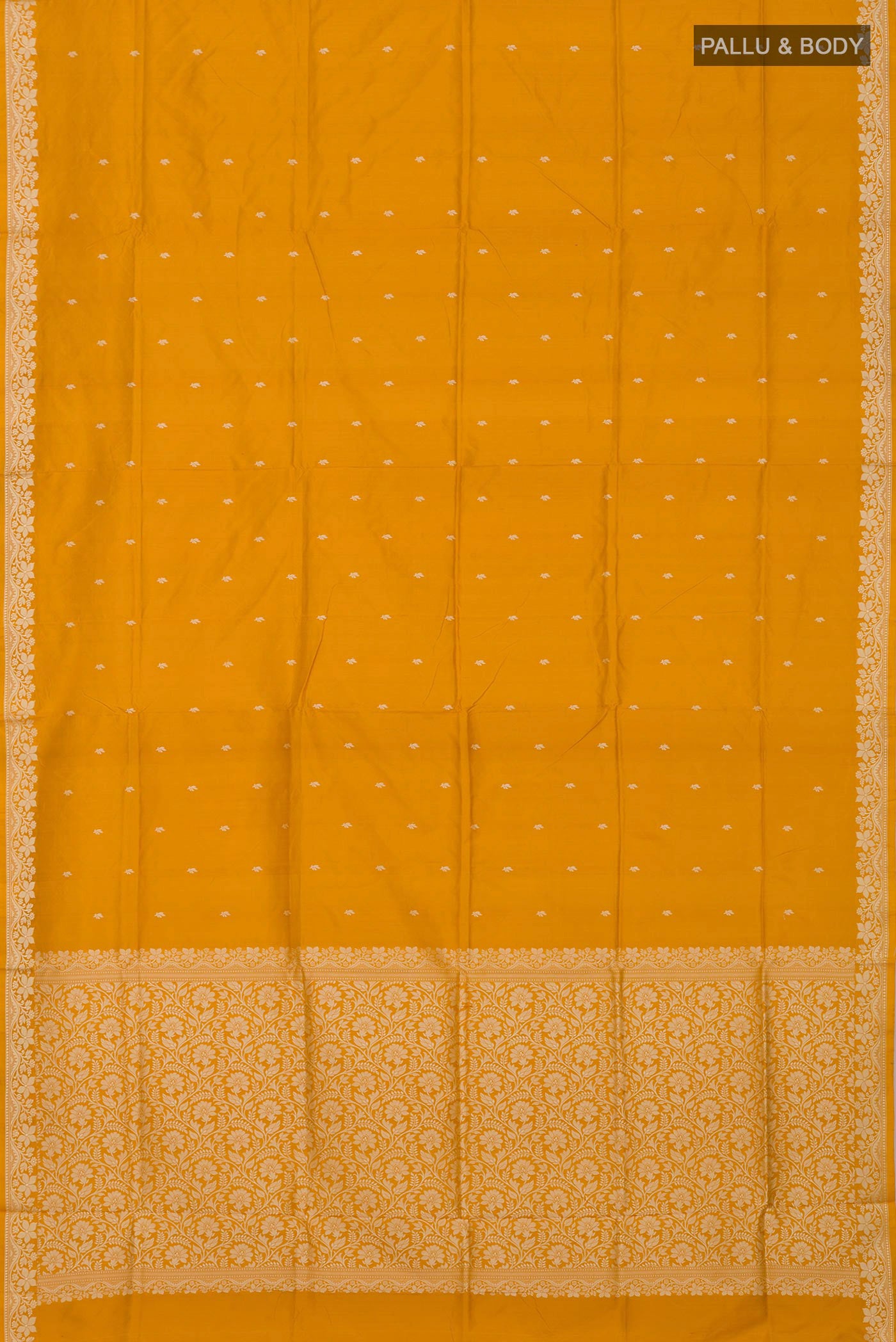 Flat view of Yellow Banarasi Katan Silk Saree with Thread Butta on the body and Thread Border. 