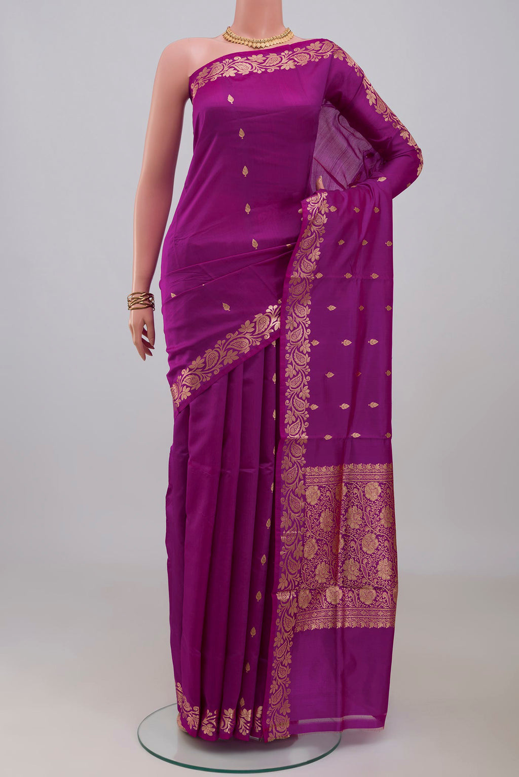 Purple Banarasi Katan Silk Saree with Zari Butta on the body and Fancy Border.  displayed on a mannequin