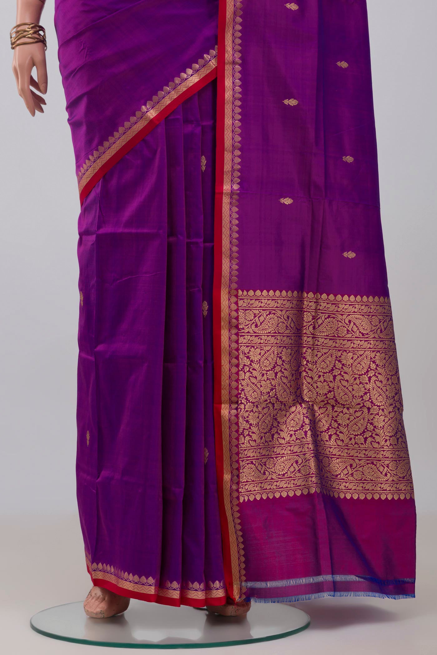 Pleats and pallu of Purple Banarasi Katan Silk Saree with Zari Butta on the body and Thin Zari Line. 