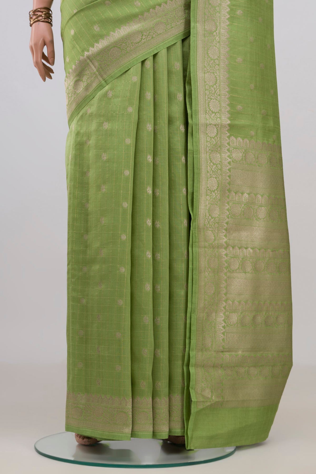 Pleats and pallu of Pure Silk Pista Green Tussar Saree with Stripes on the body and Zari Border. 