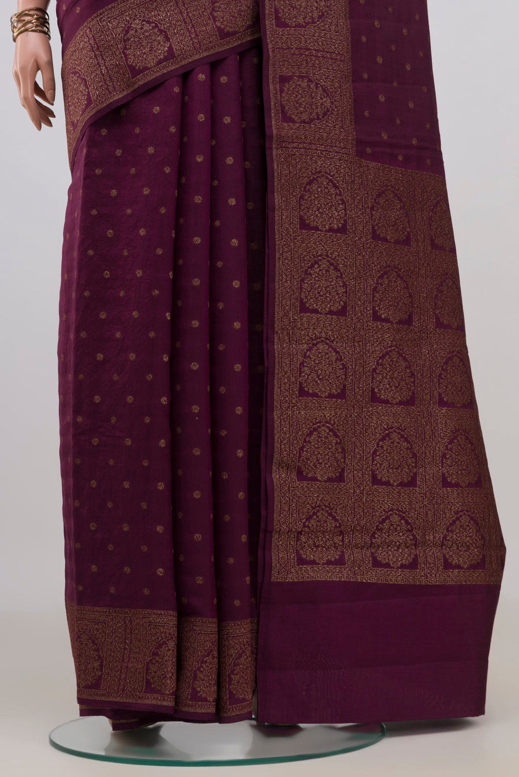 Pleats and pallu of Pure Silk Burgundy Tussar Saree with Zari Butta on the body and Zari Border. 