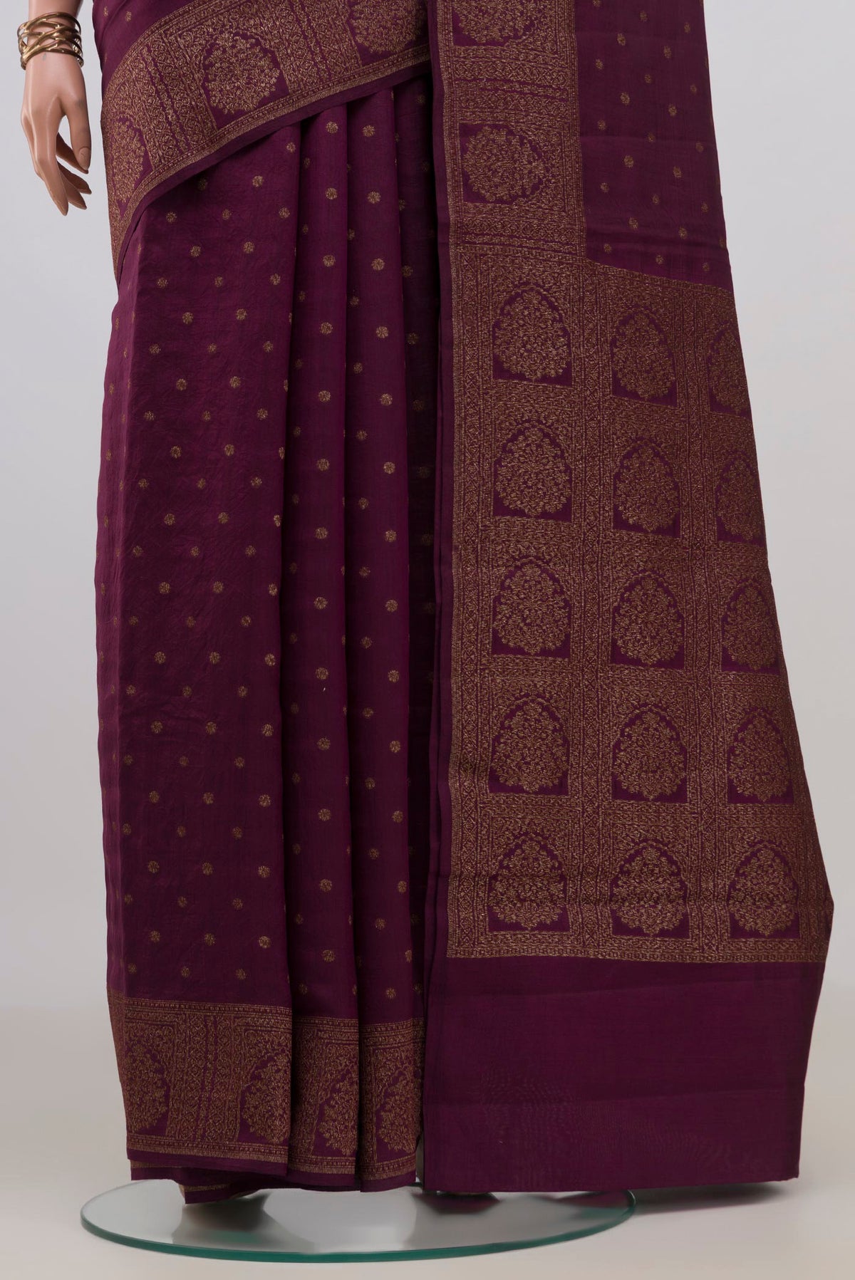 Pleats and pallu of Pure Silk Burgundy Tussar Saree with Zari Butta on the body and Zari Border. 
