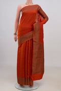 Pure Silk Rust Tussar Saree with Zari Butta on the body and Fancy Border.  displayed on a mannequin