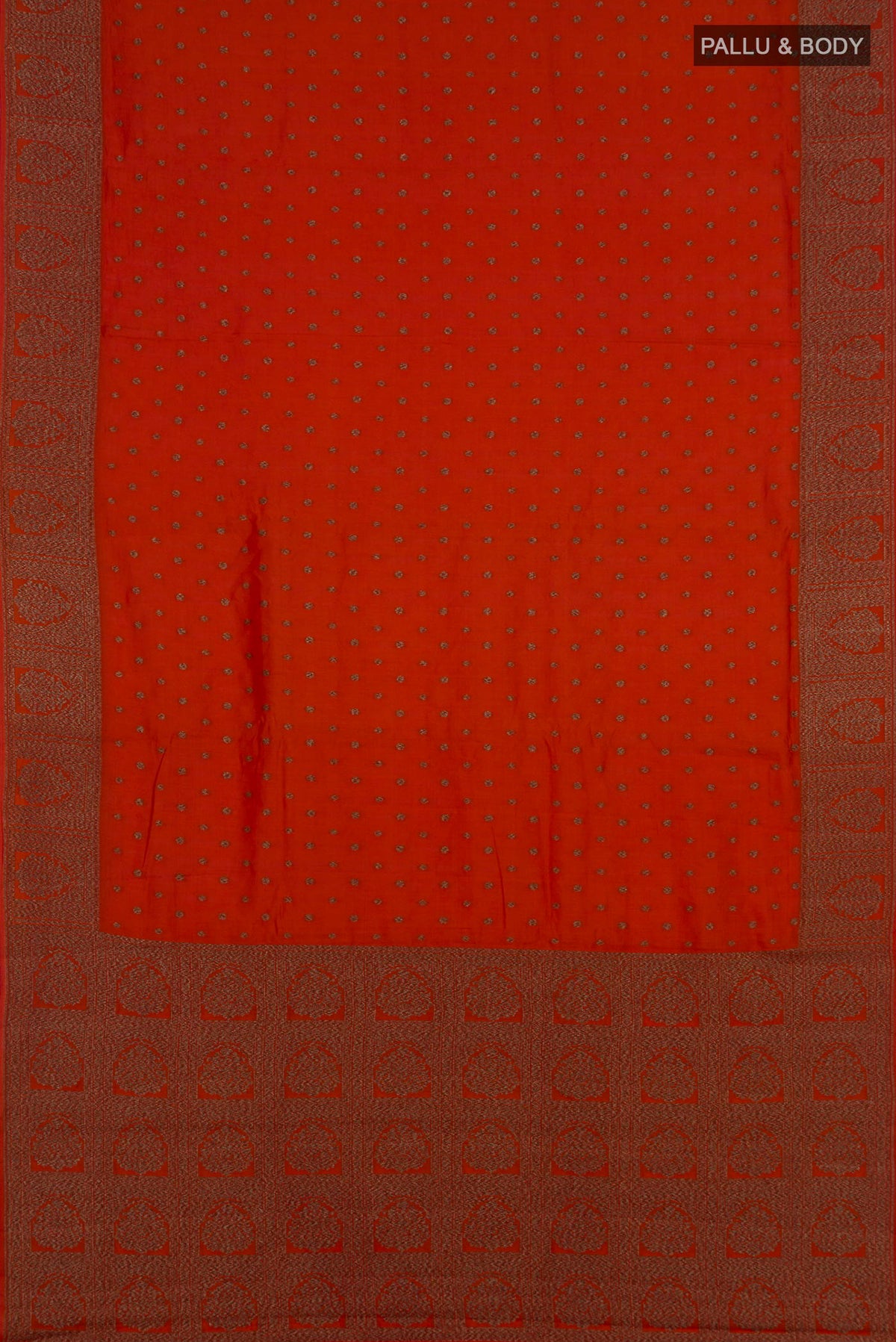 Flat view of Pure Silk Rust Tussar Saree with Zari Butta on the body and Fancy Border. 