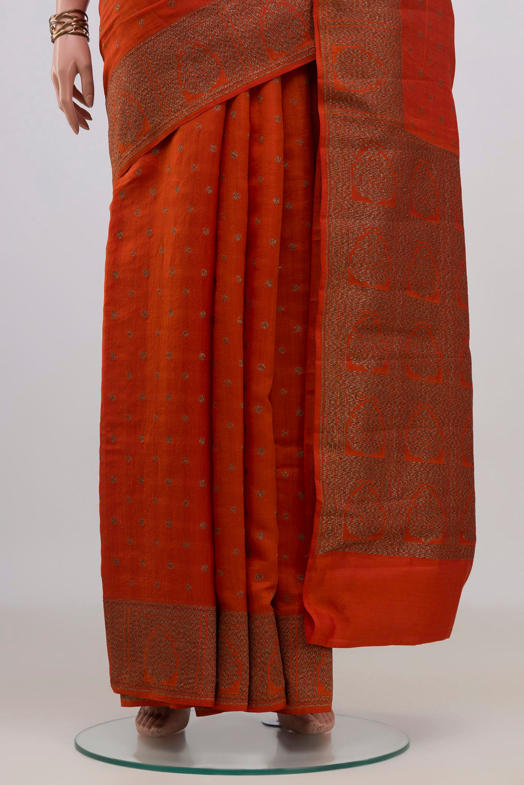 Pleats and pallu of Pure Silk Rust Tussar Saree with Zari Butta on the body and Fancy Border. 