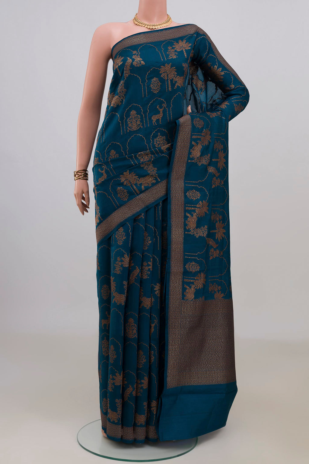 Pure Silk Blue Tussar Saree with Zari Brocade on the body and Fancy Border.  displayed on a mannequin