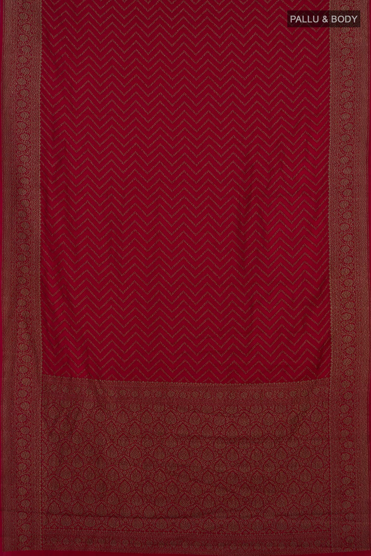 Flat view of Pure Silk Maroon Banarasi Raw Saree with Zig Zag design on the body and Zari Border. 