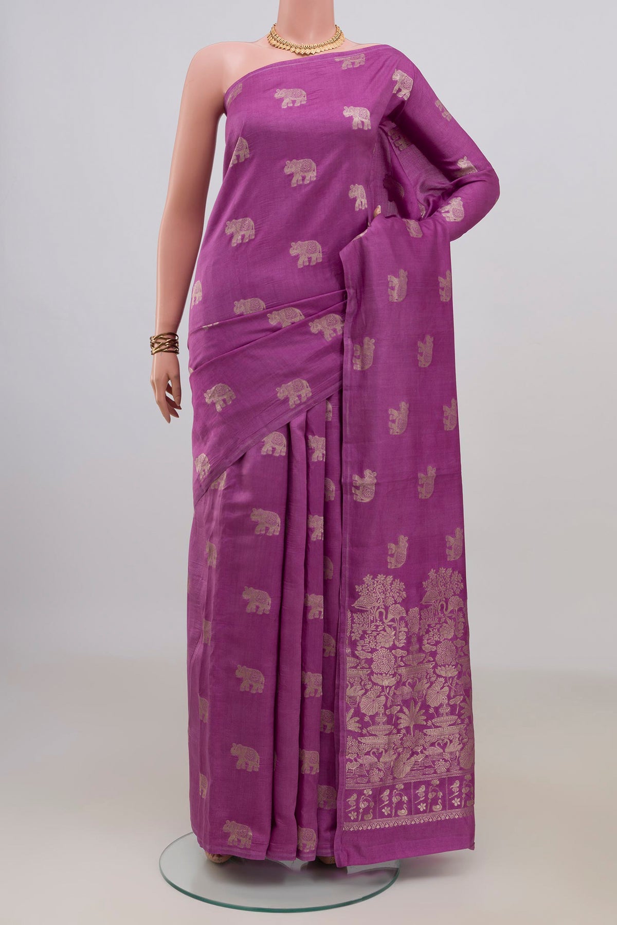 Purple Tussar Saree with Zari Butta on the body and Without Border.  displayed on a mannequin