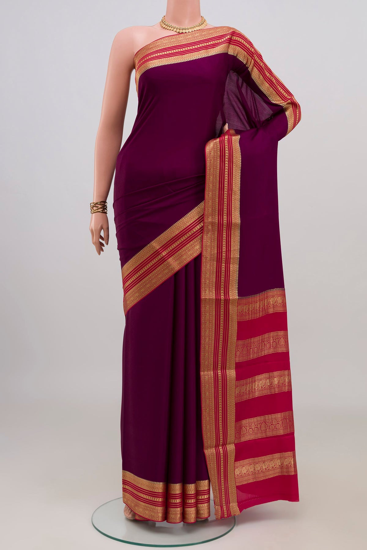 Purple Mysore Crepe Saree with Plain Body and Zari Border.  displayed on a mannequin