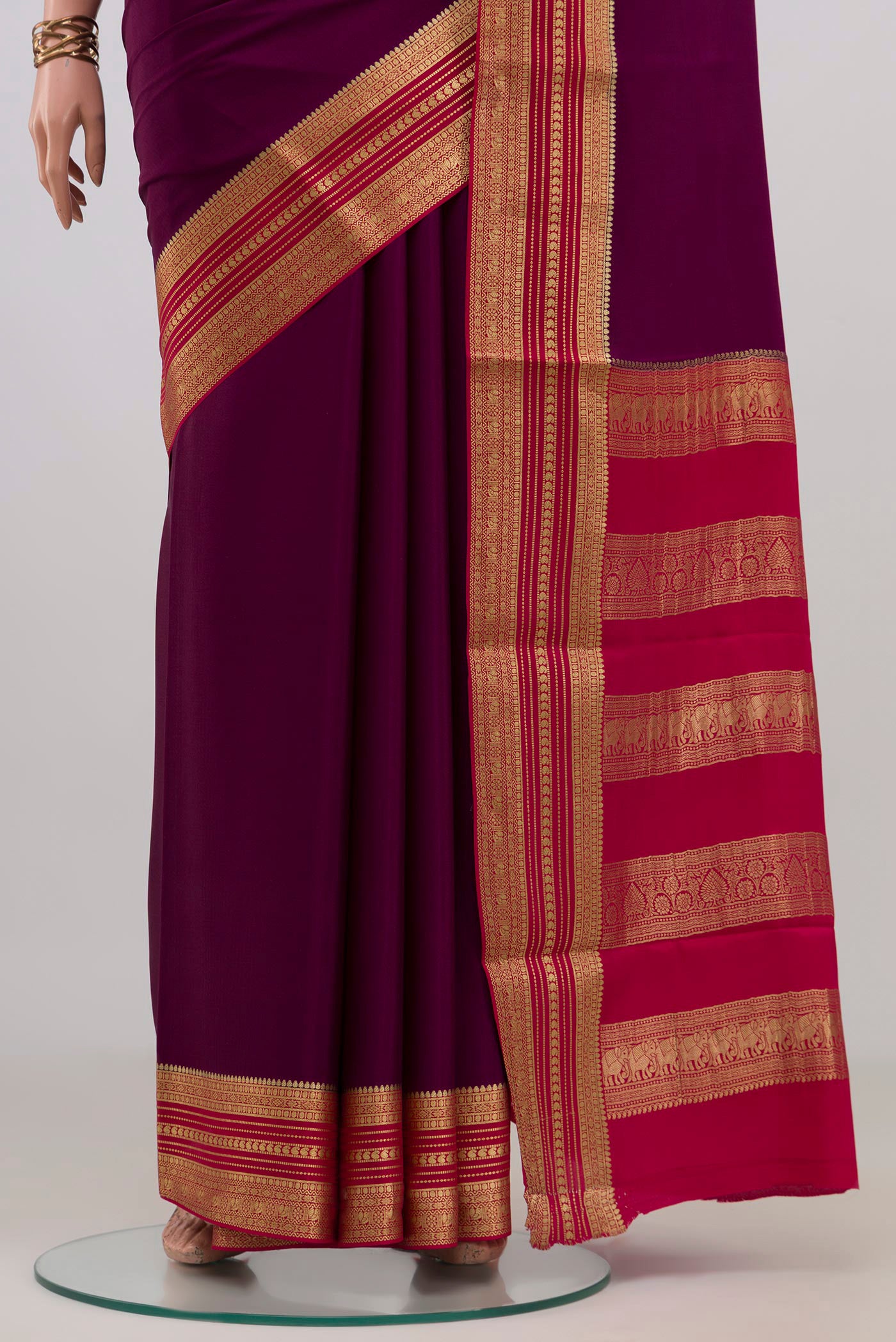 Pleats and pallu of Purple Mysore Crepe Saree with Plain Body and Zari Border. 
