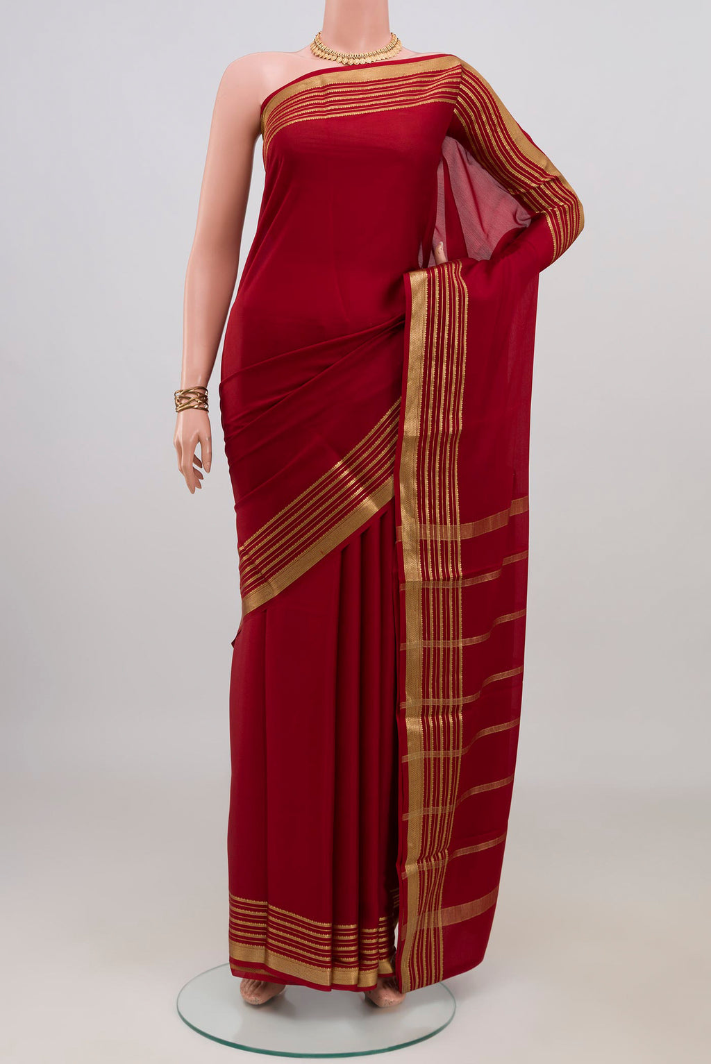 Maroon Mysore Crepe Saree with Plain Body and Zari Border.  displayed on a mannequin