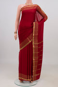 Maroon Mysore Crepe Saree with Plain Body and Zari Border.  displayed on a mannequin