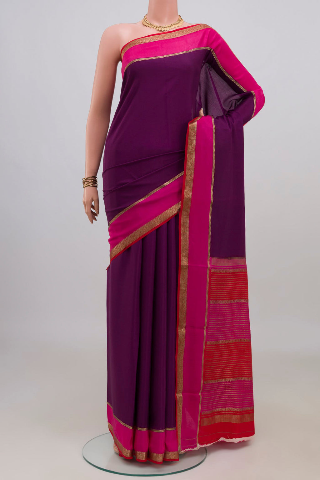 Magenta Mysore Crepe Saree with Plain Body and Zari Border.  displayed on a mannequin