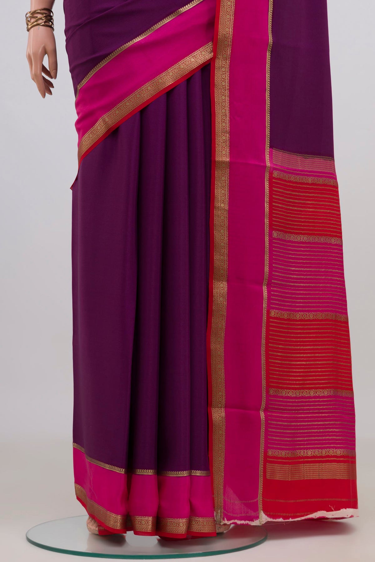 Pleats and pallu of Magenta Mysore Crepe Saree with Plain Body and Zari Border. 