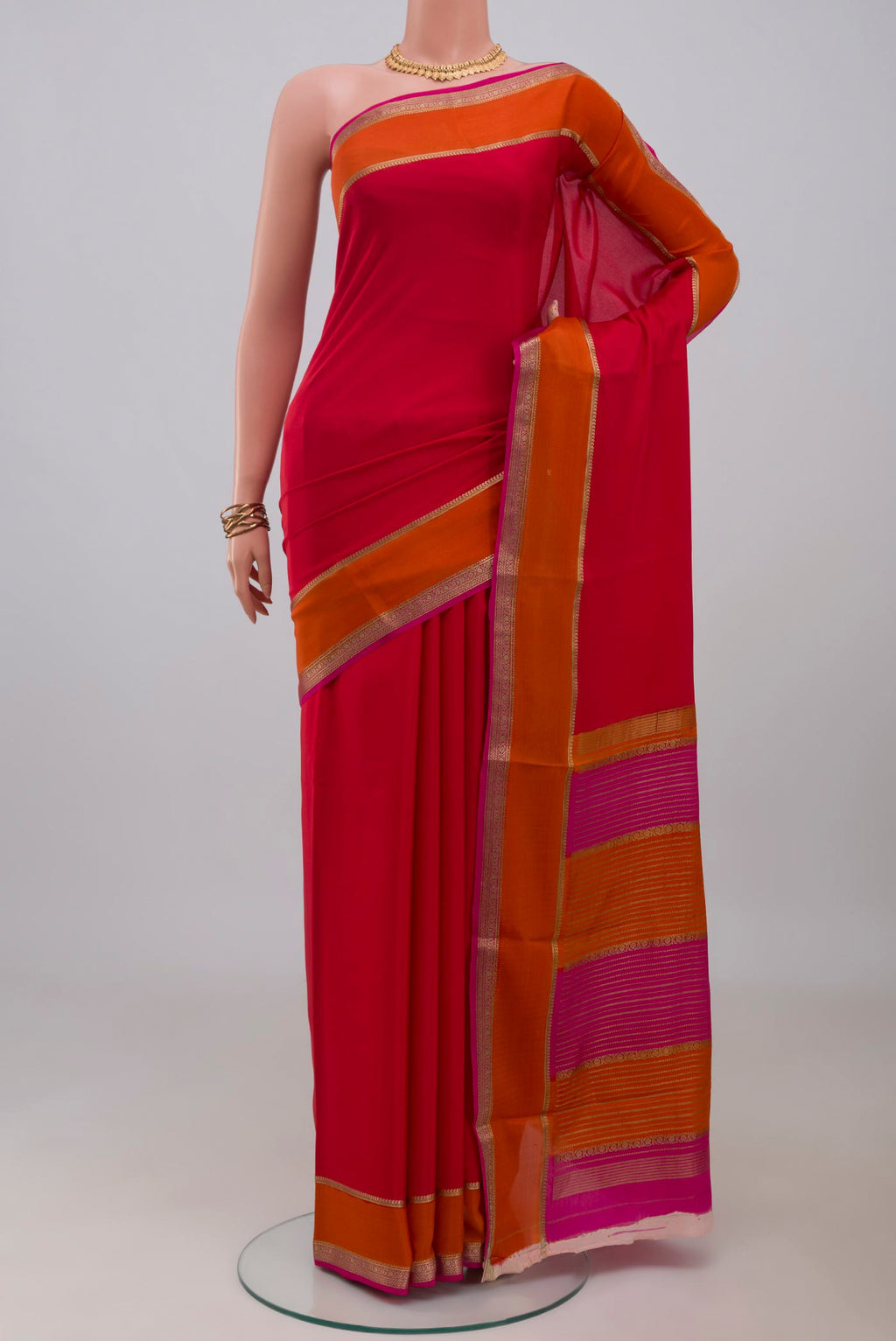 Pink Mysore Crepe Saree with Plain Body and Zari Border.  displayed on a mannequin