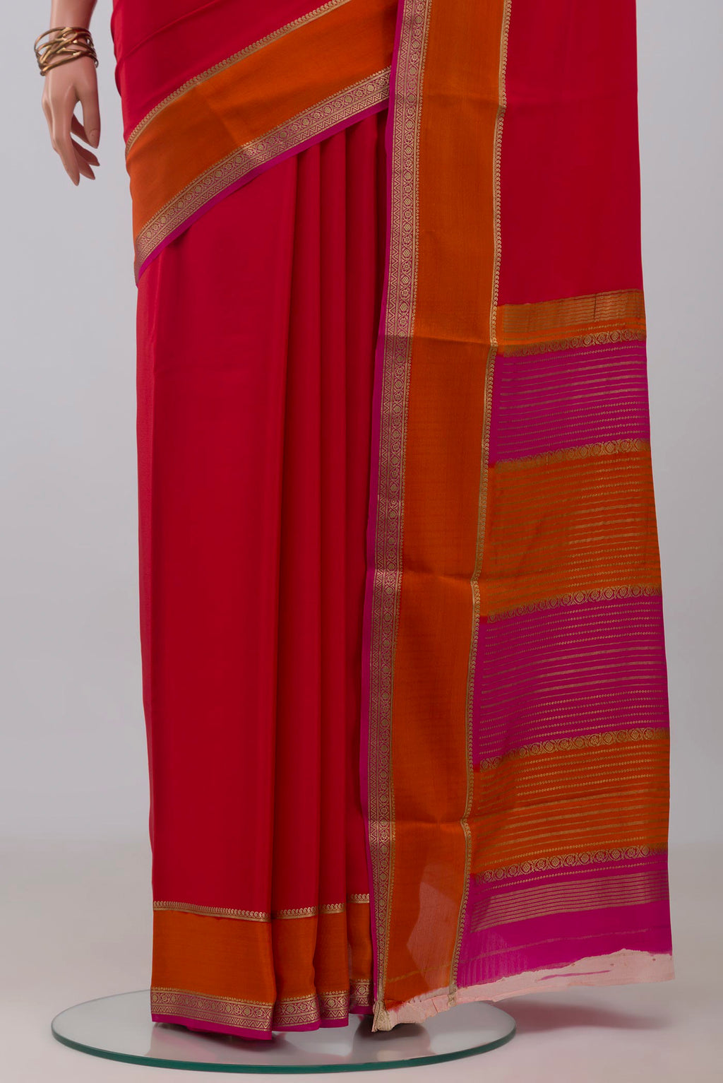 Pleats and pallu of Pink Mysore Crepe Saree with Plain Body and Zari Border. 
