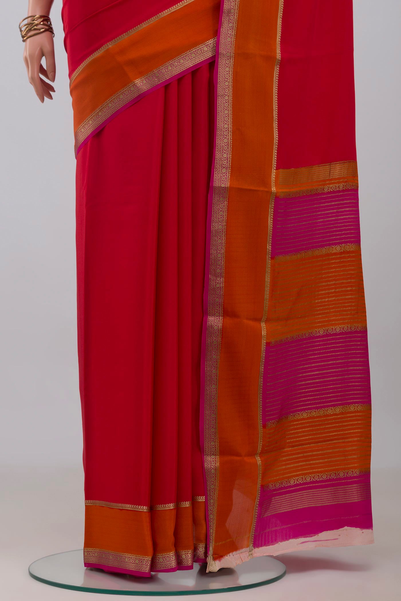 Pleats and pallu of Pink Mysore Crepe Saree with Plain Body and Zari Border. 
