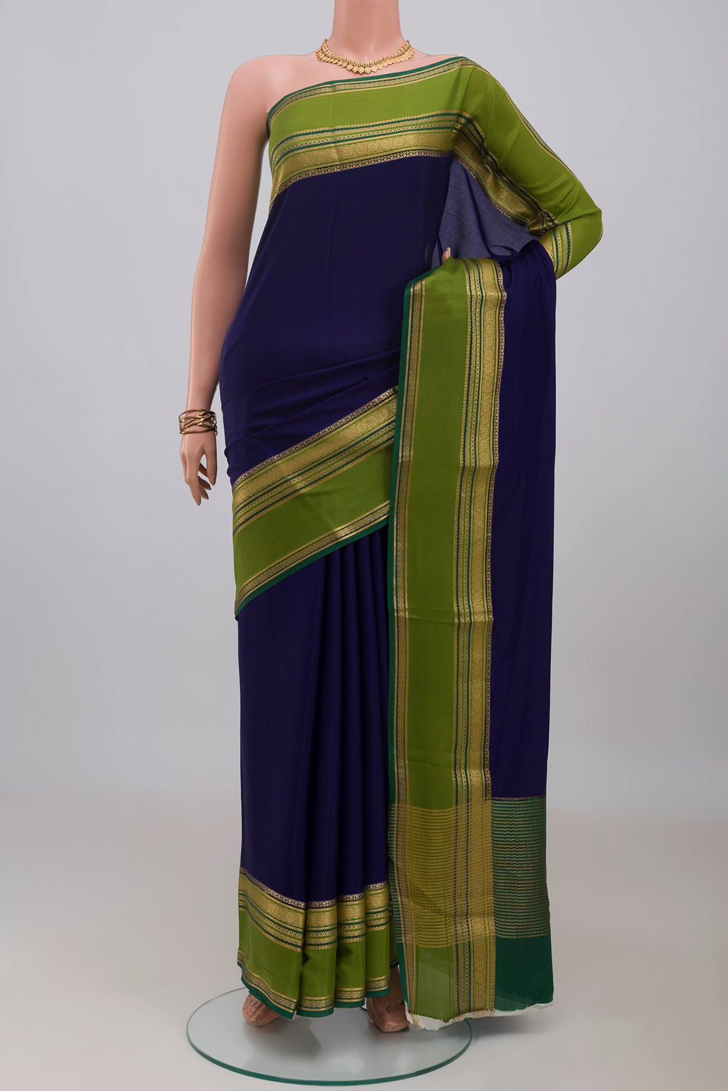 Navy Blue Mysore Crepe Saree with Plain Body and Zari Border.  displayed on a mannequin