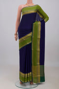 Navy Blue Mysore Crepe Saree with Plain Body and Zari Border.  displayed on a mannequin