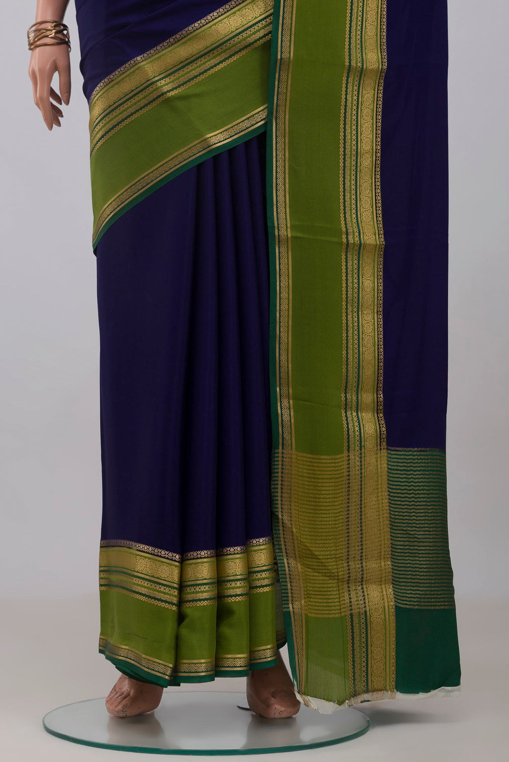 Pleats and pallu of Navy Blue Mysore Crepe Saree with Plain Body and Zari Border. 