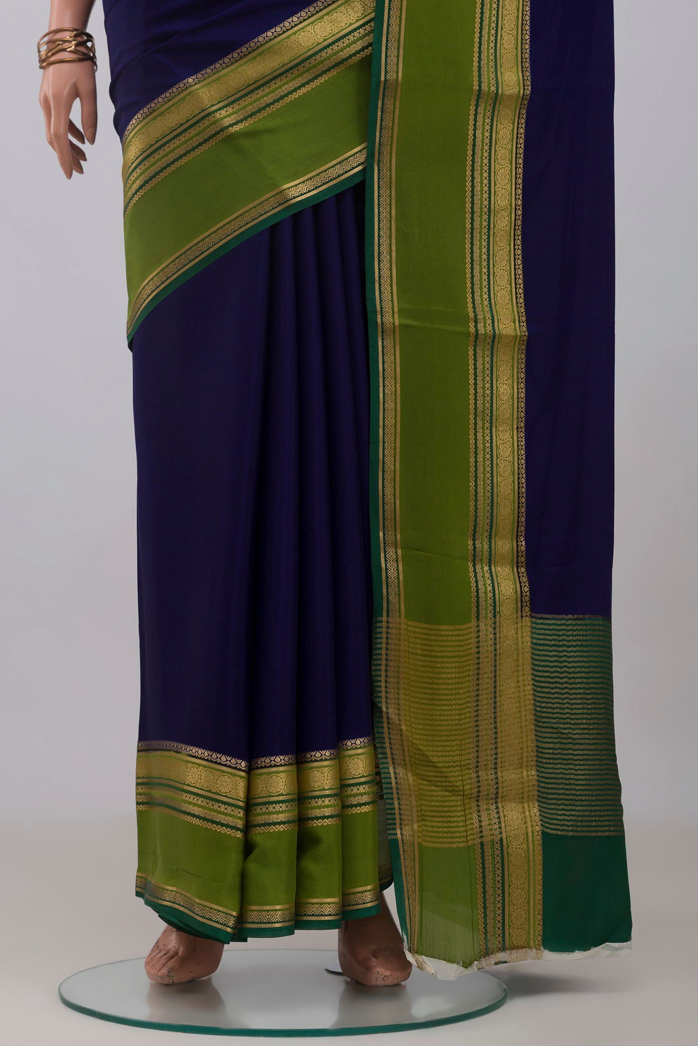 Pleats and pallu of Navy Blue Mysore Crepe Saree with Plain Body and Zari Border. 