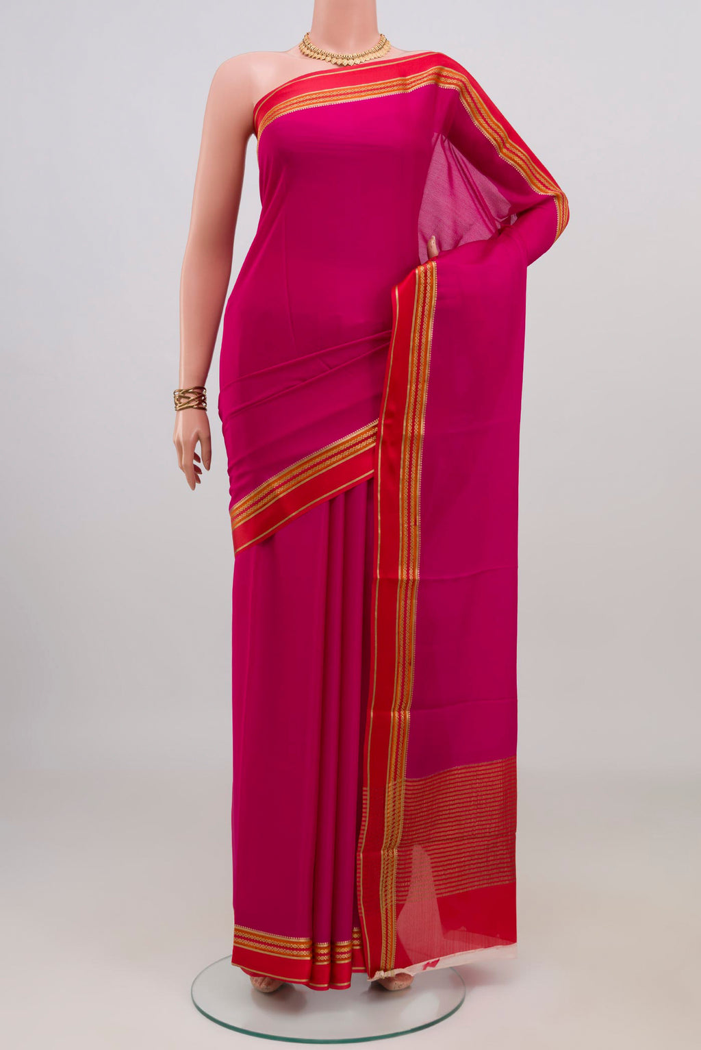 Pink Mysore Crepe Saree with Plain Body and Plain Border.  displayed on a mannequin