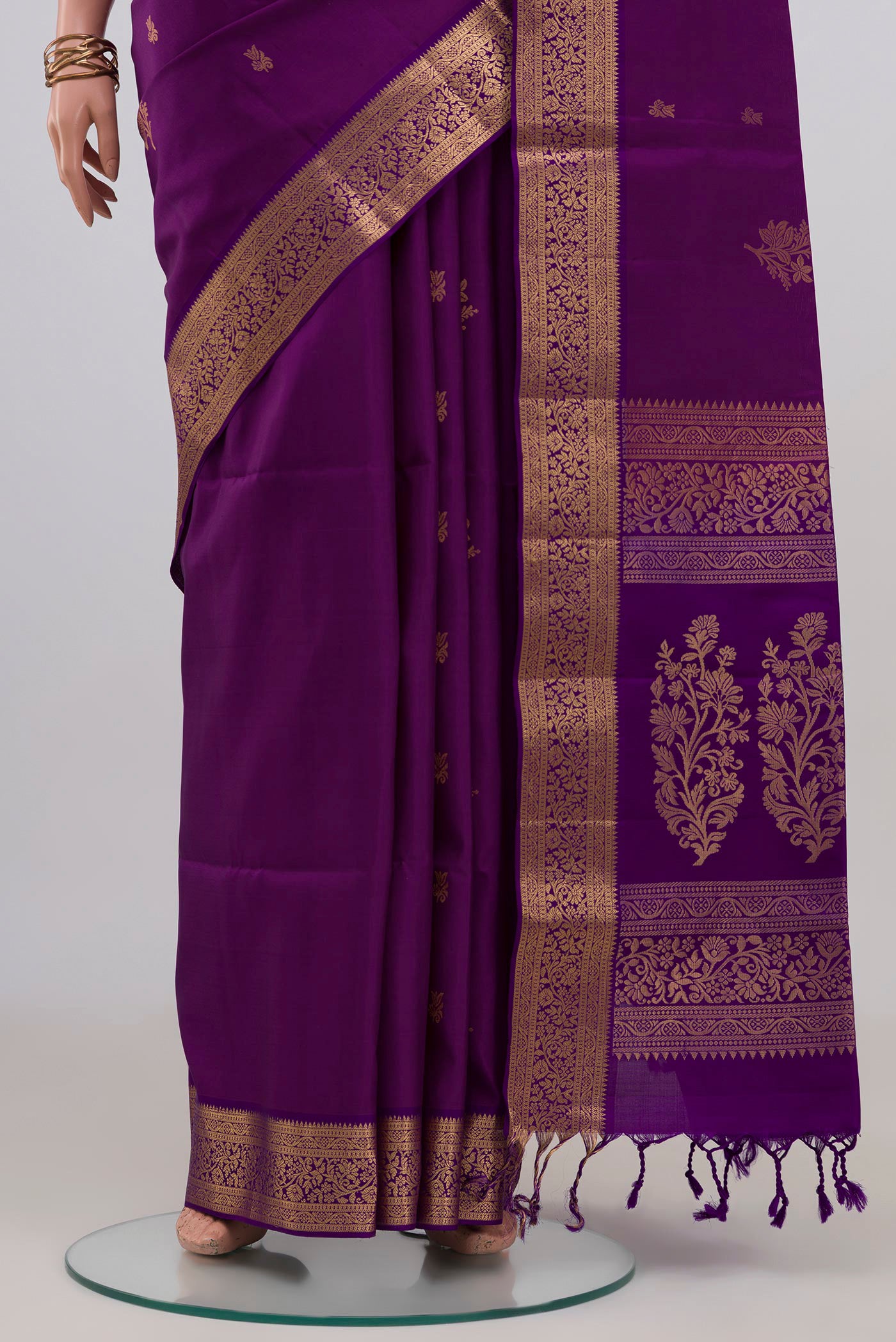 Pleats and pallu of Violet Soft Silk Saree with Zari Butta on the body and Zari Border. 