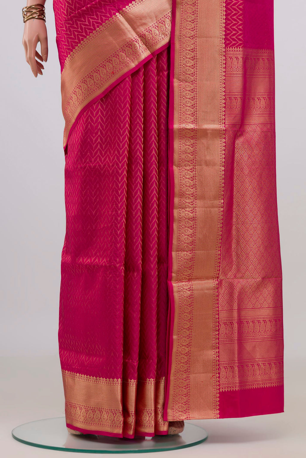Pleats and pallu of Pure Silk Pink Soft Saree with Zari Brocade on the body and Zari Border. 