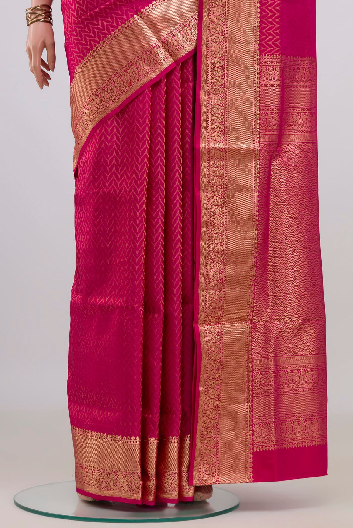 Pleats and pallu of Pure Silk Pink Soft Saree with Zari Brocade on the body and Zari Border. 