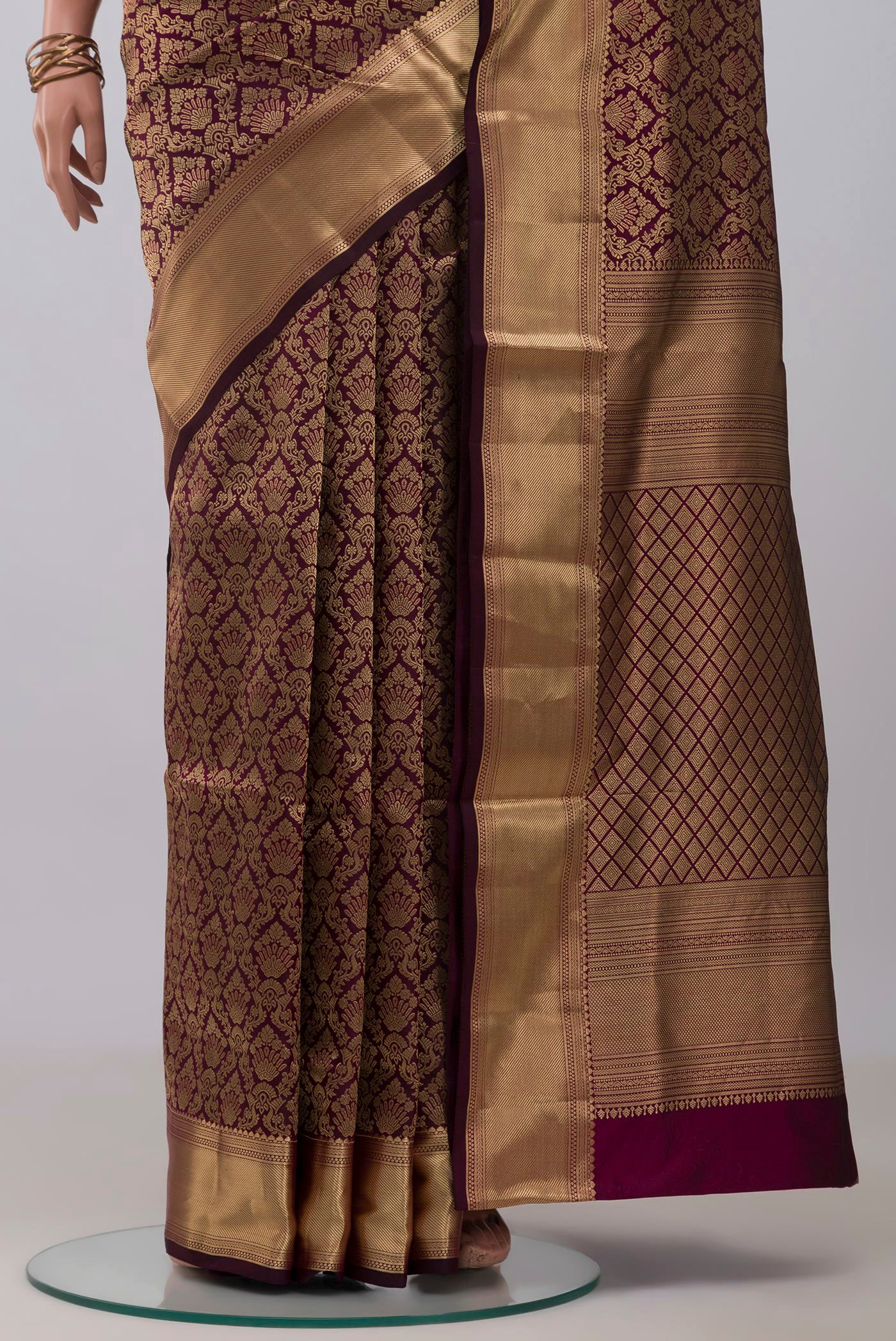 Pleats and pallu of Purple Soft Silk Saree with Zari Brocade on the body and Zari Border. 