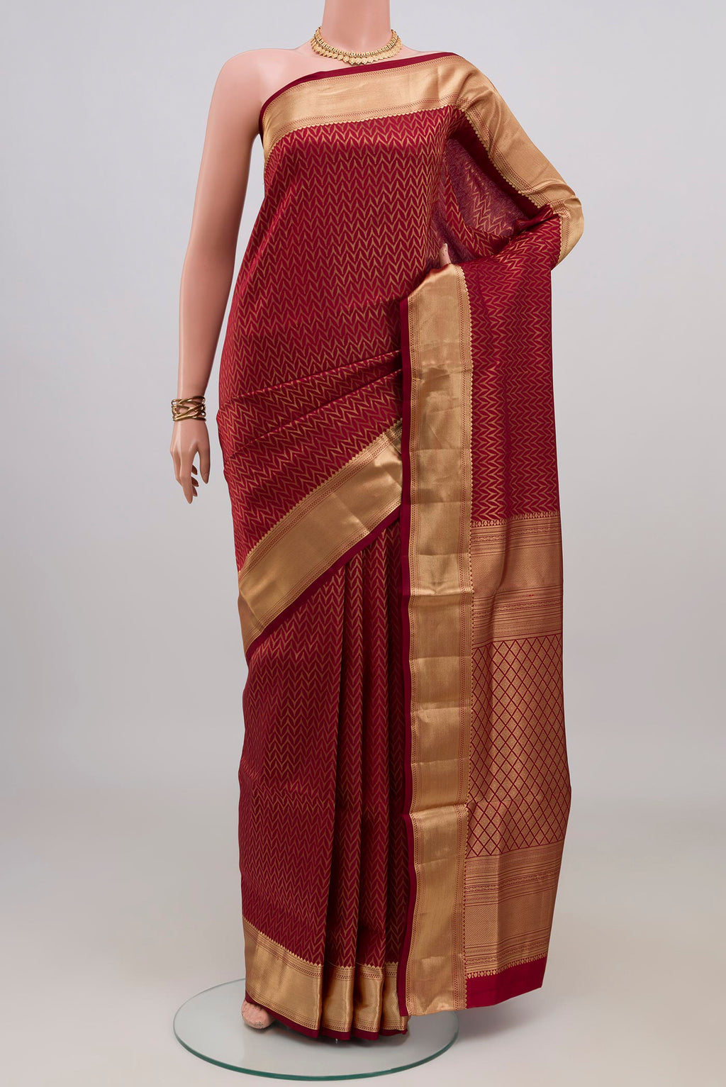 Maroon Soft Silk Saree with Zari Brocade on the body and Zari Border.  displayed on a mannequin