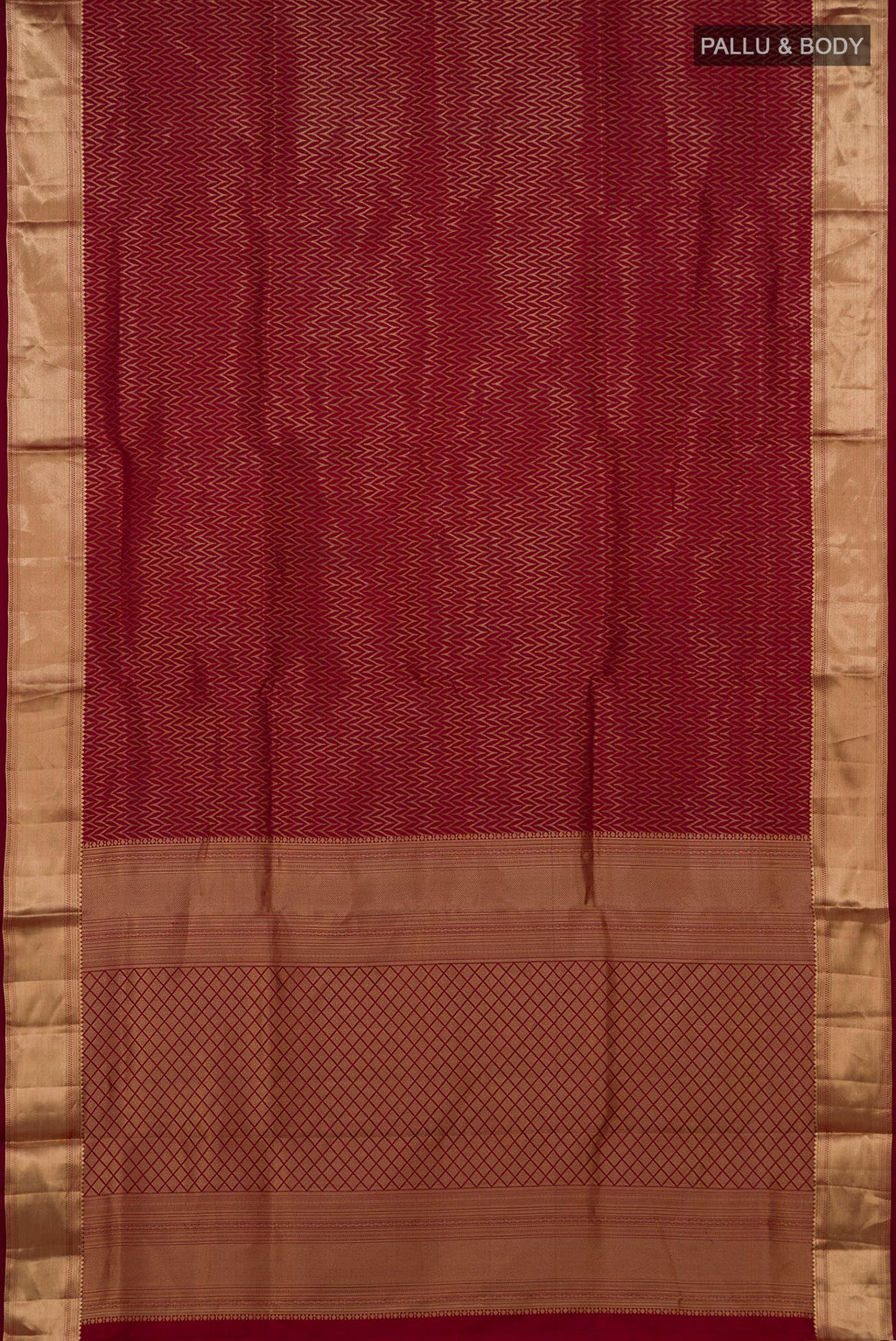 Flat view of Maroon Soft Silk Saree with Zari Brocade on the body and Zari Border. 
