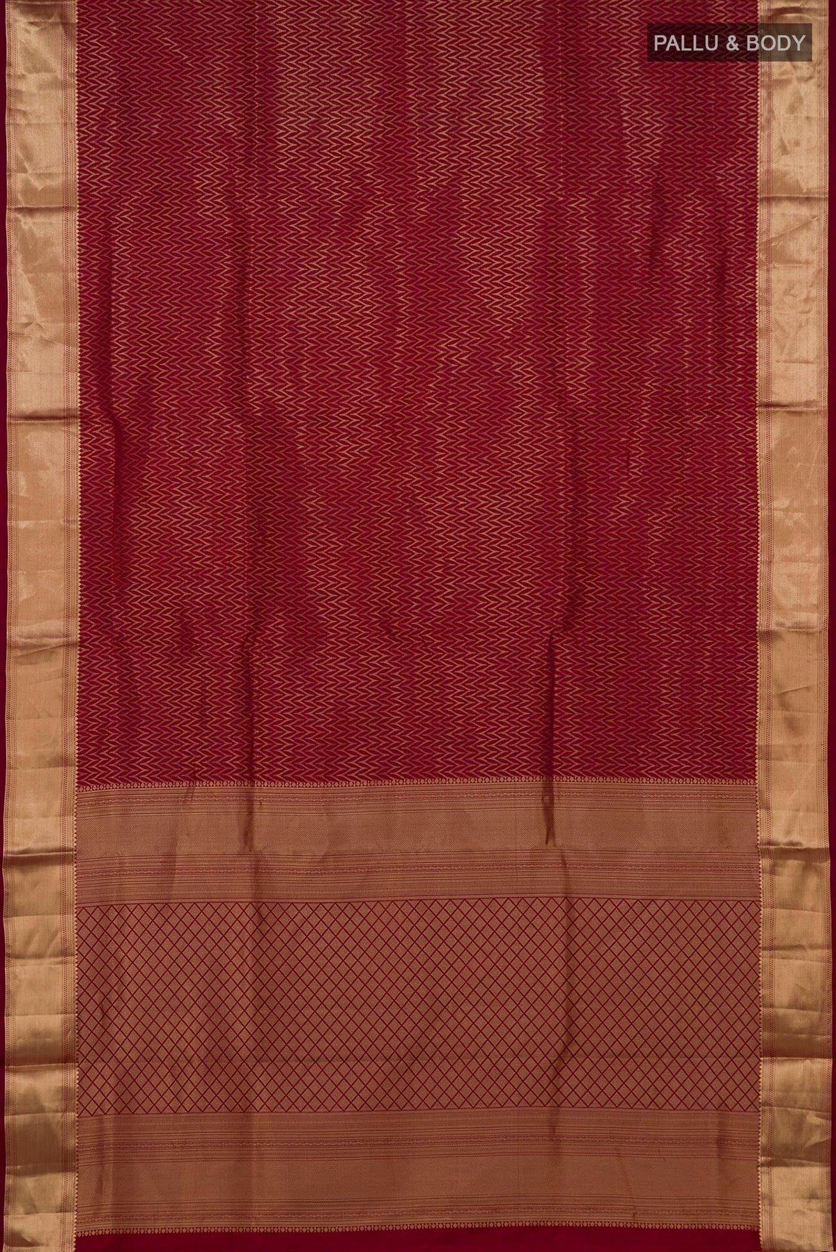 Flat view of Maroon Soft Silk Saree with Zari Brocade on the body and Zari Border. 