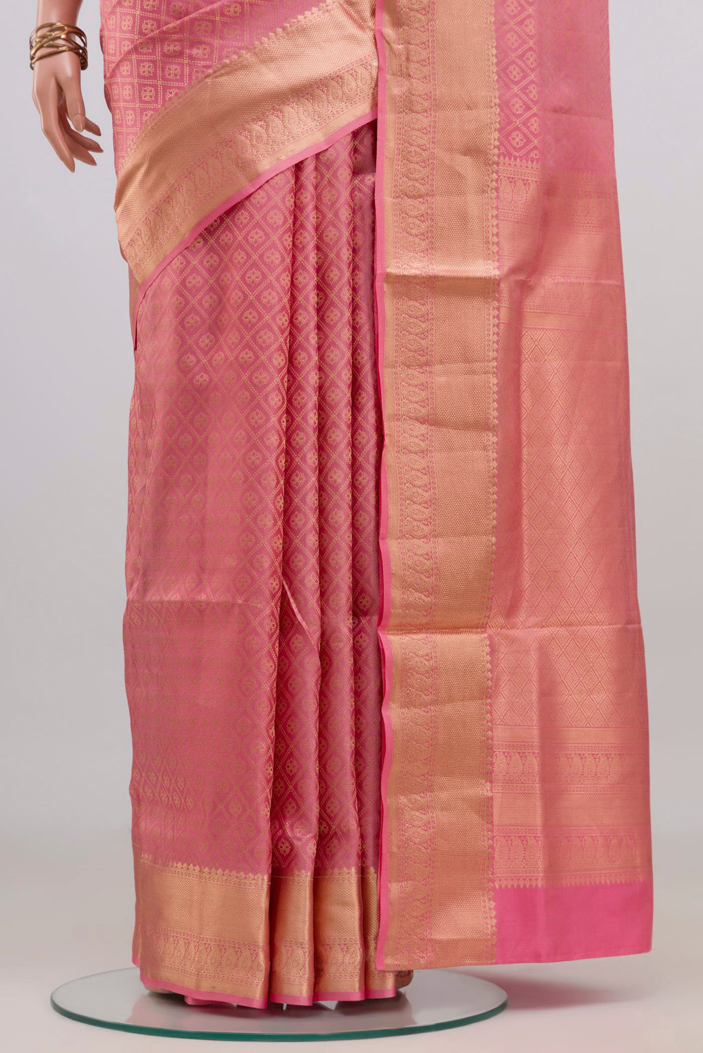 Pleats and pallu of Rose pink Soft Silk Saree with Zari Brocade on the body and Zari Border. 