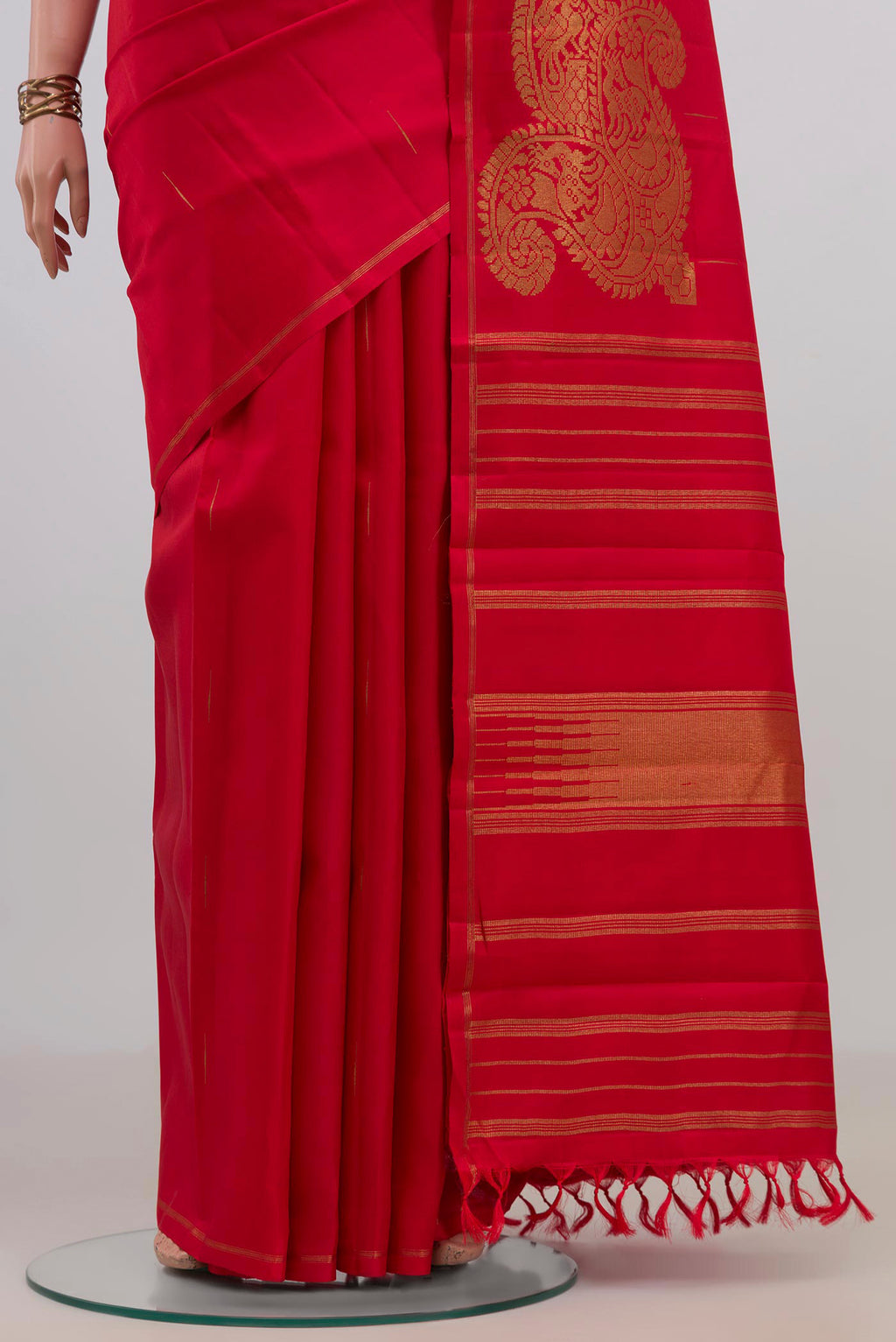 Pleats and pallu of Pure Silk Pure Zari Red Kanjivaram Saree with Zari Butta on the body and Thin Zari Line. 