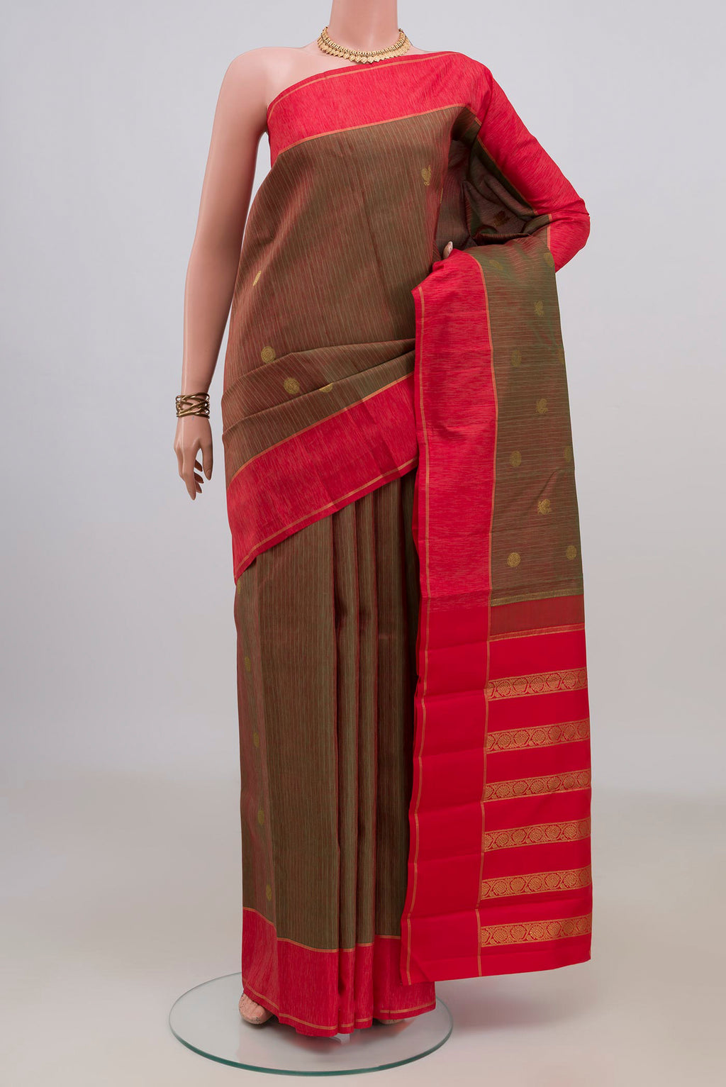 Pure Silk Green Dual Tone Kanjivaram Saree with Stripes on the body and Plain Border.  displayed on a mannequin