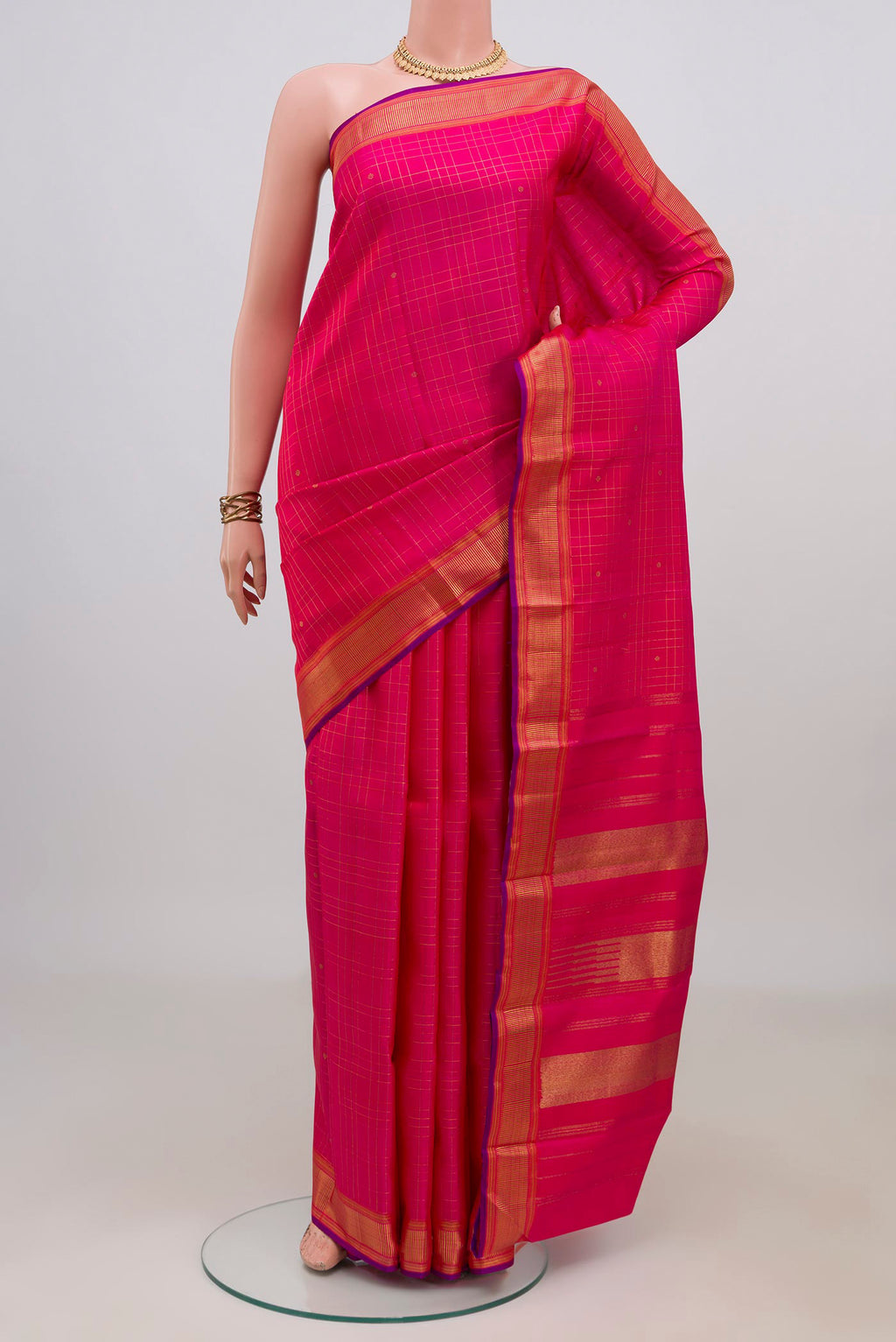 Pure Silk Pure Zari Pink Kanchipuram Saree with Checked design on the body and Zari Border.  displayed on a mannequin