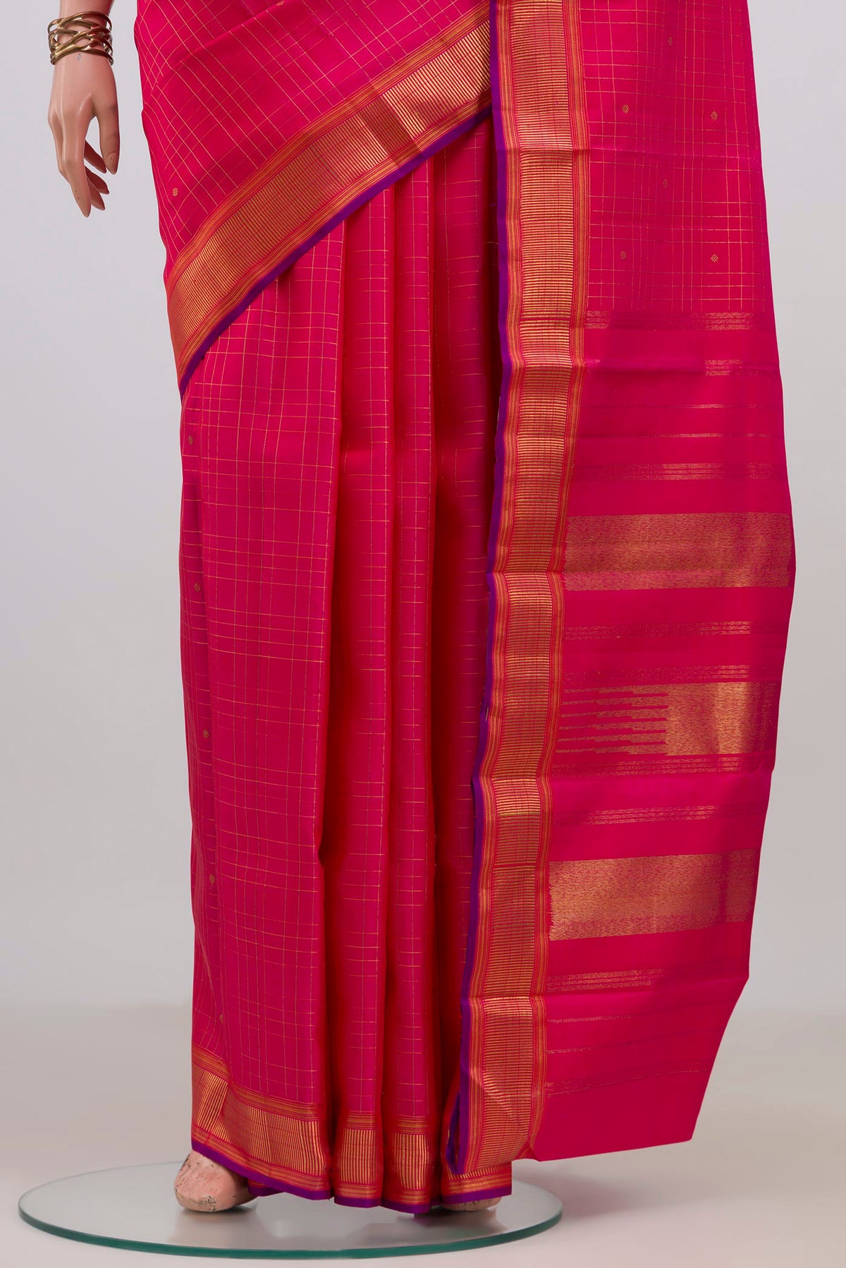 Pleats and pallu of Pure Silk Pure Zari Pink Kanchipuram Saree with Checked design on the body and Zari Border. 