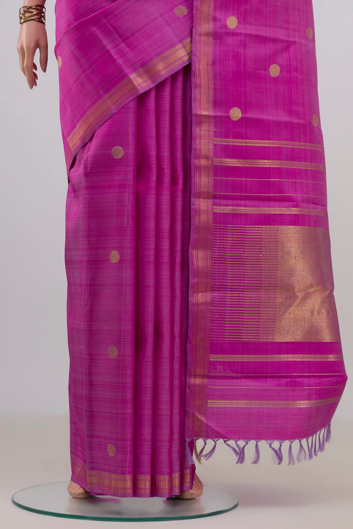 Pleats and pallu of Pure Silk Pure Zari Magenta Kanchipuram Saree with Zari Butta on the body and Zari Border. 