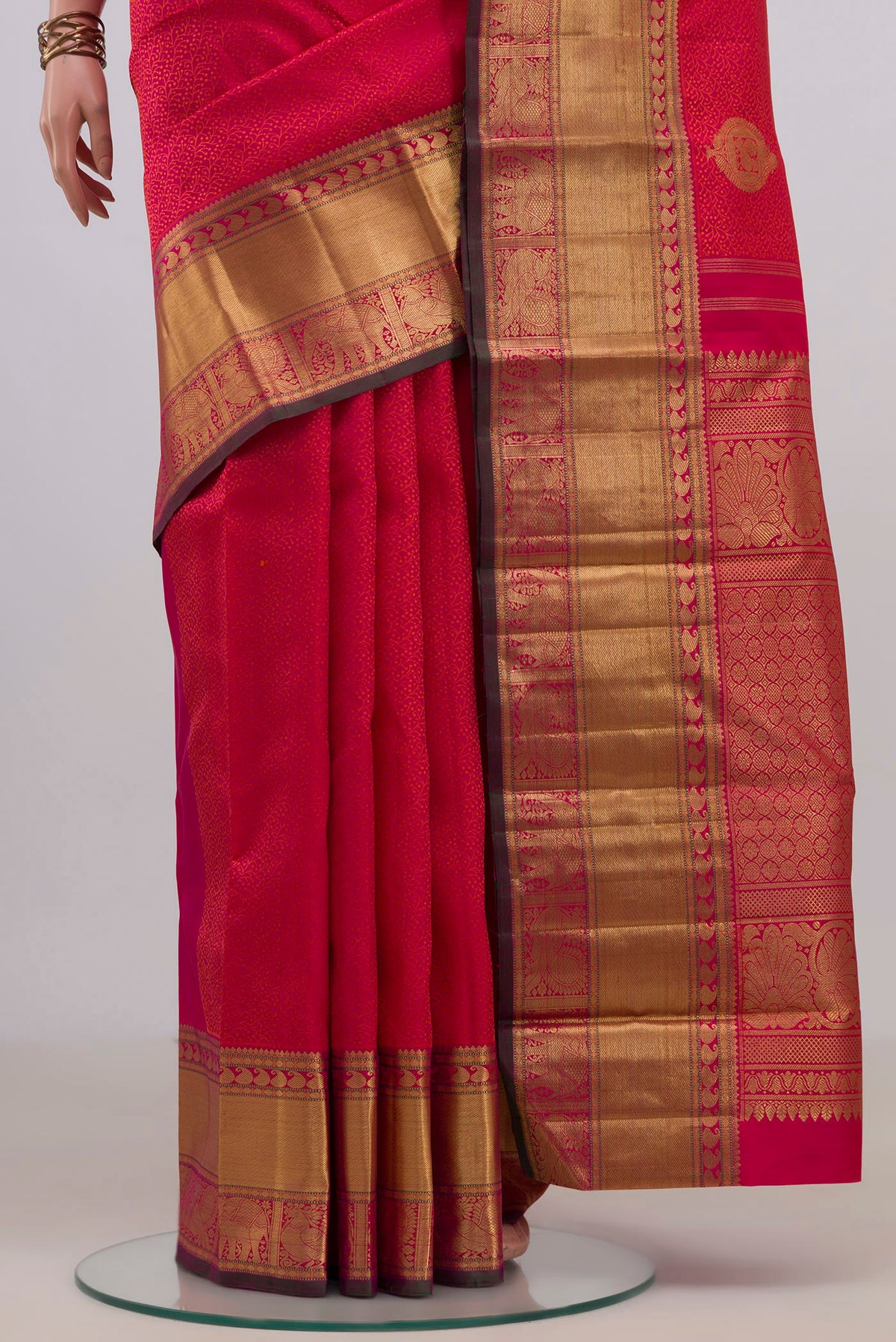 Pleats and pallu of Pure Silk Pure Zari Pink Kanjivaram Saree with Jacquard With Zari Butta on the body and Zari Border. 