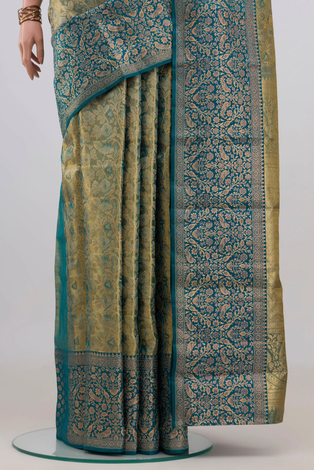 Pleats and pallu of Gold with Blue Color Kanchipuram Tissue Saree with Zari Brocade on the body and Fancy Border. 