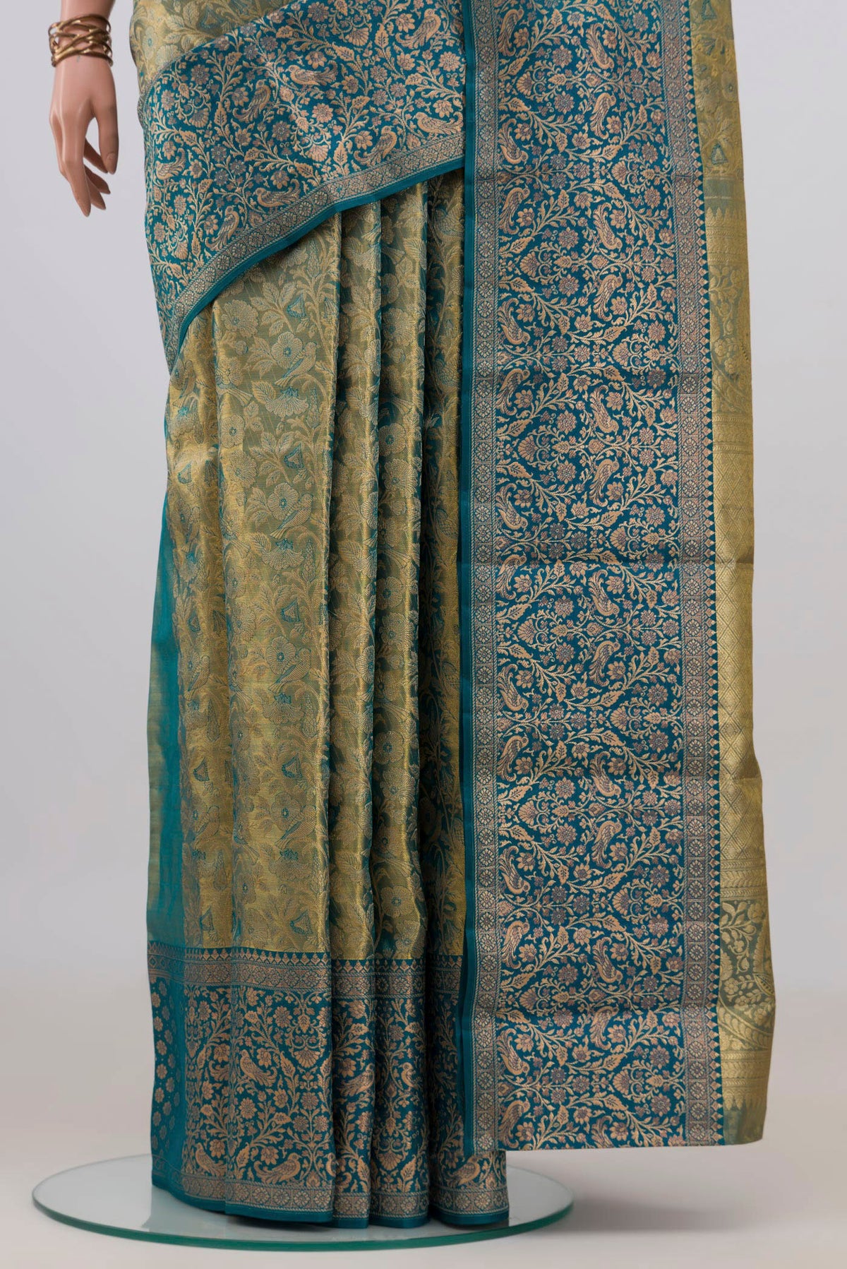 Pleats and pallu of Gold with Blue Color Kanchipuram Tissue Saree with Zari Brocade on the body and Fancy Border. 