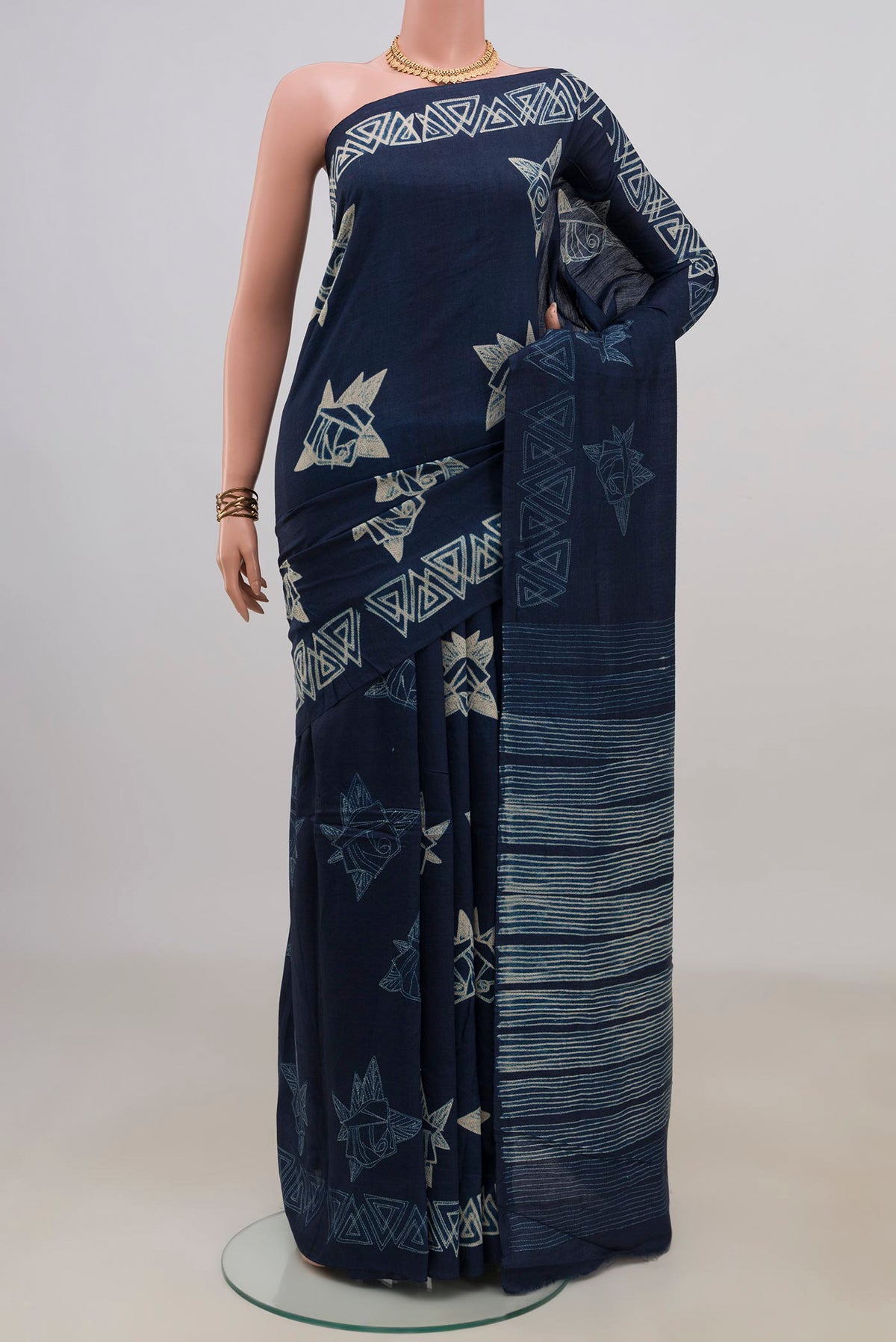 Pure Silk Navy Blue Tussar Saree with Fancy on the body and Without Border.  displayed on a mannequin