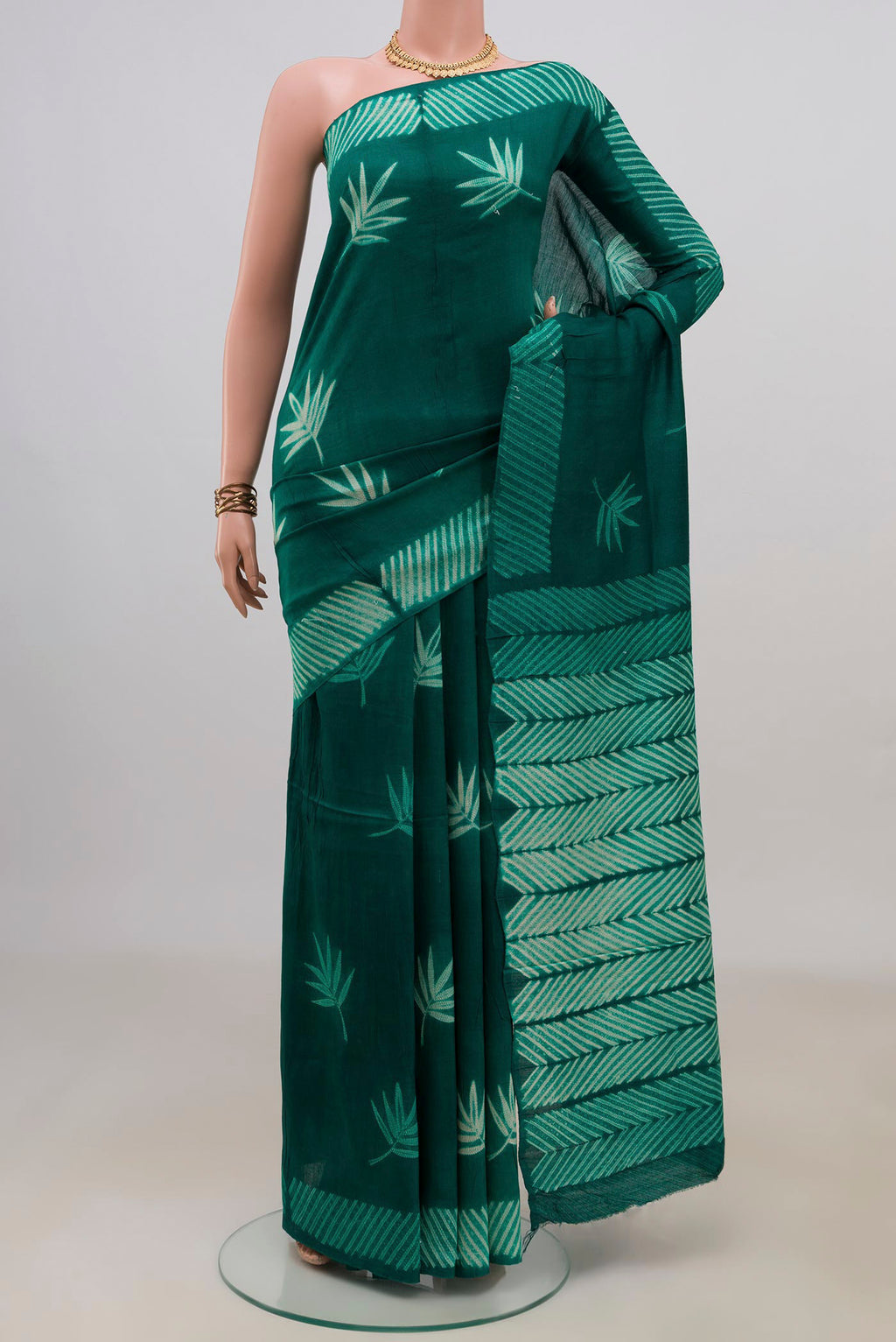 Pure Silk Green Tussar Saree with Fancy on the body and Without Border.  displayed on a mannequin