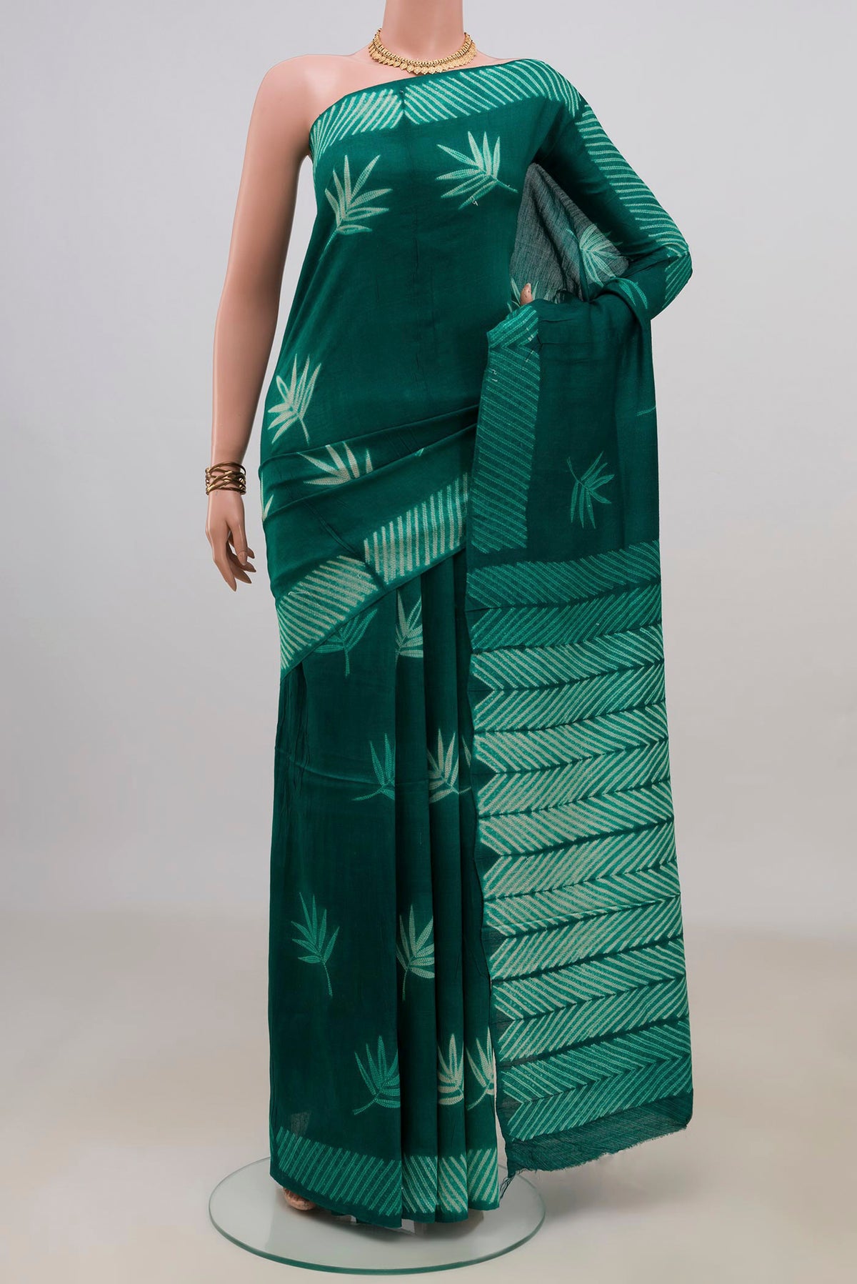 Pure Silk Green Tussar Saree with Fancy on the body and Without Border.  displayed on a mannequin