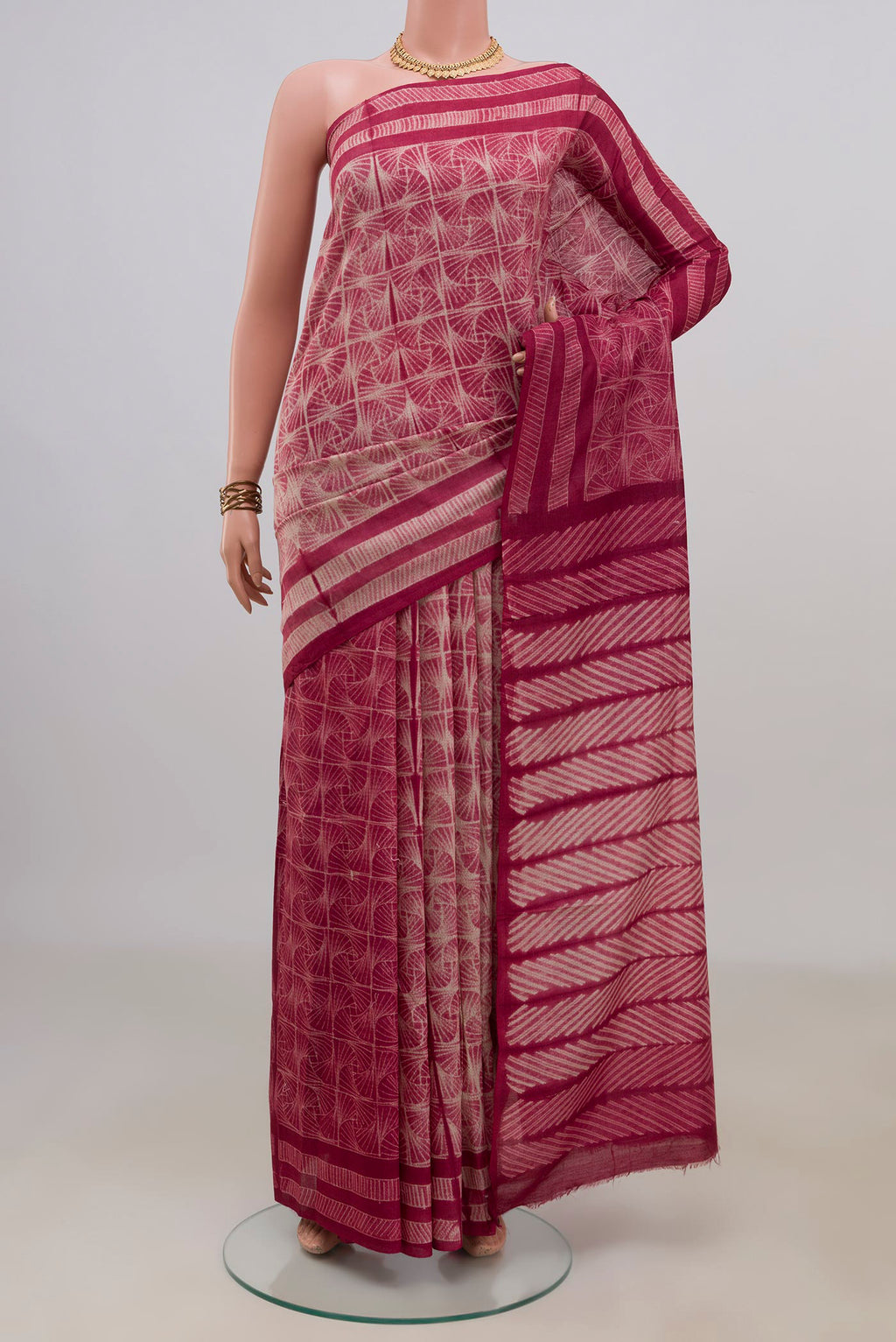 Pure Silk Maroon Tussar Saree with Fancy on the body and Without Border.  displayed on a mannequin