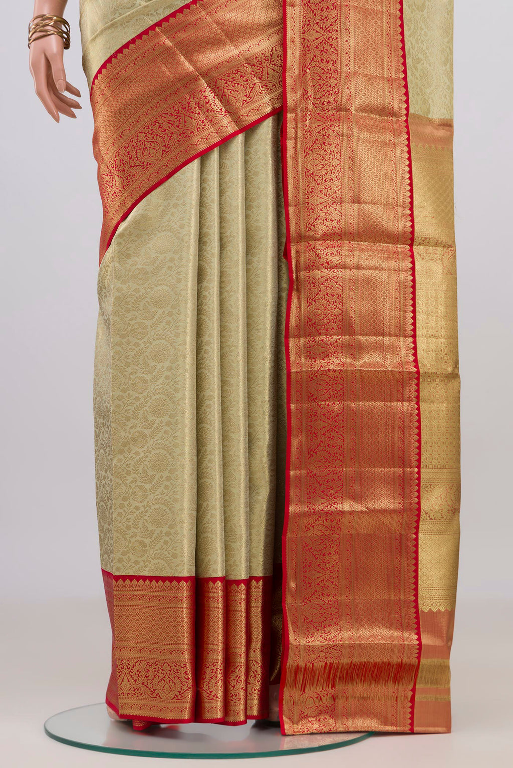 Pleats and pallu of Cream Kanjivaram Tissue Silk Saree with Zari Brocade on the body and Zari Border. 
